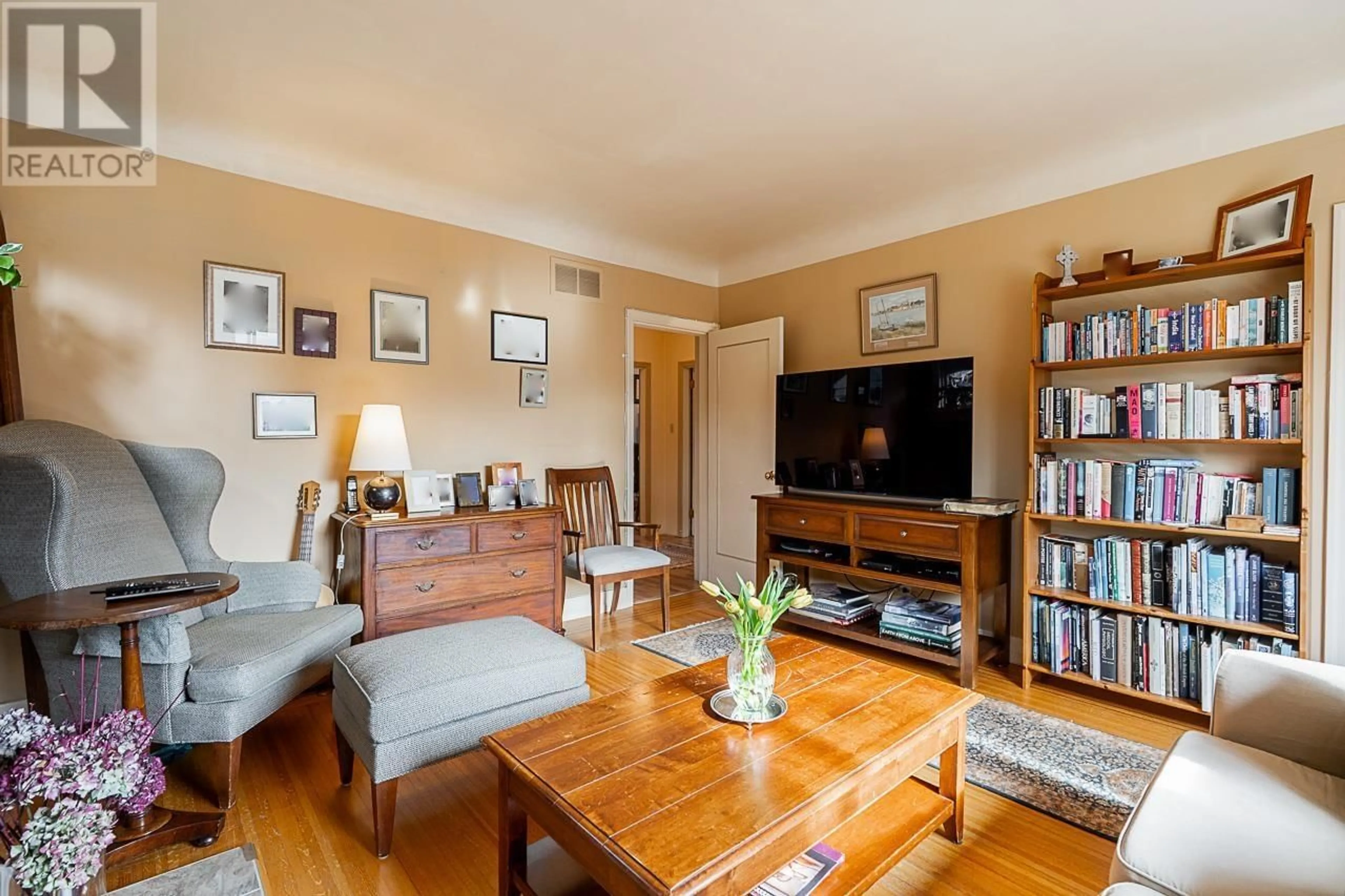 Living room with furniture, wood/laminate floor for 4463 W 14TH AVENUE, Vancouver British Columbia V6R2Y2