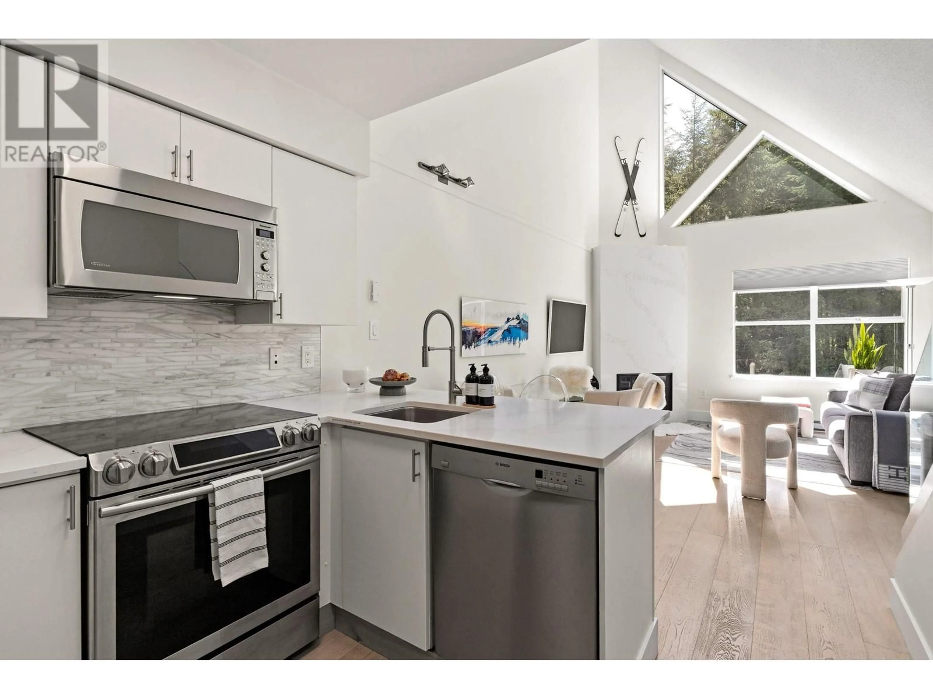 Open concept kitchen, ceramic/tile floor for 306 - 4749 SPEARHEAD DRIVE, Whistler British Columbia V8E1E9