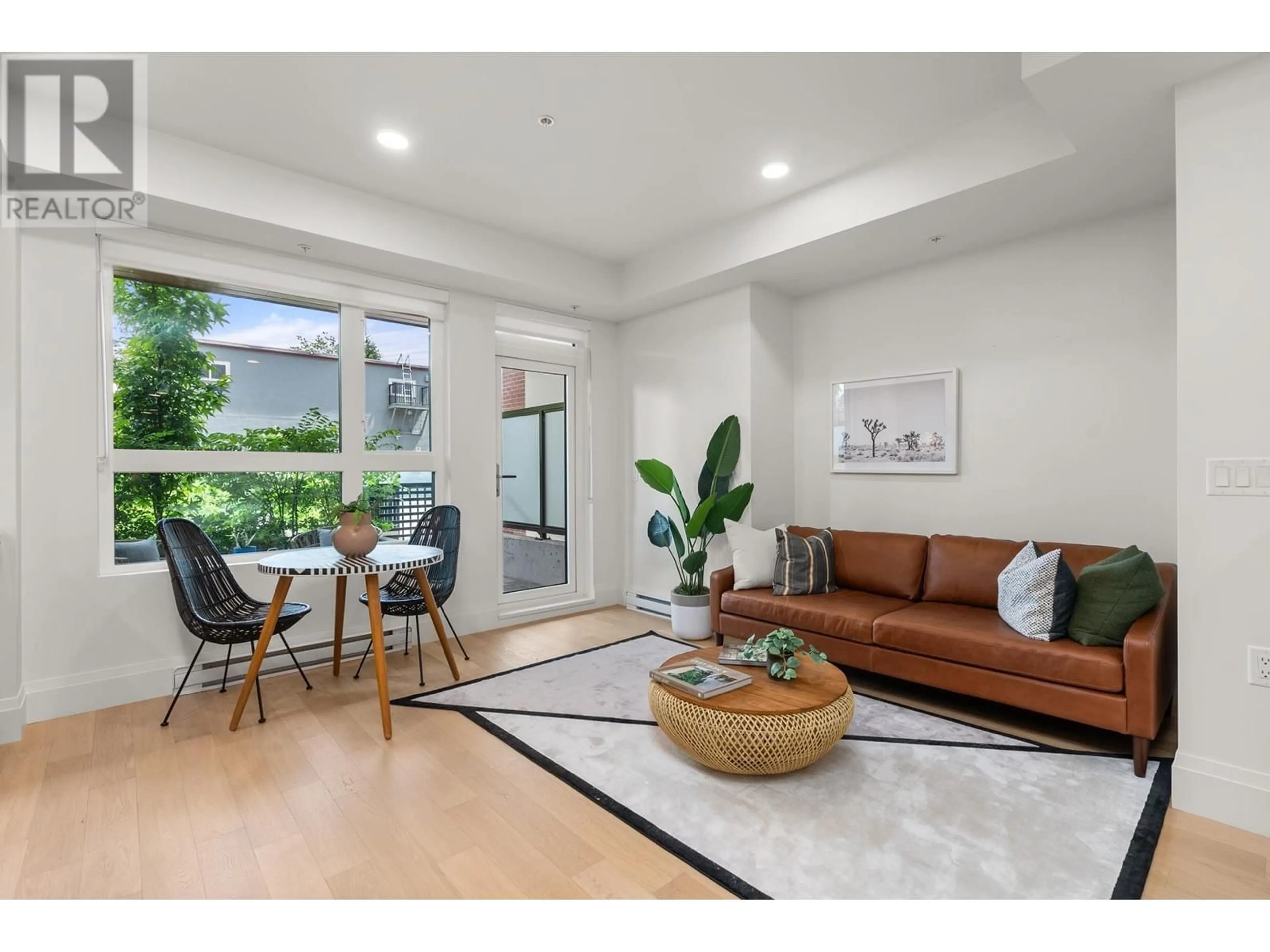 Living room with furniture, unknown for 106 2550 GARDEN DRIVE, Vancouver British Columbia V5N4X6