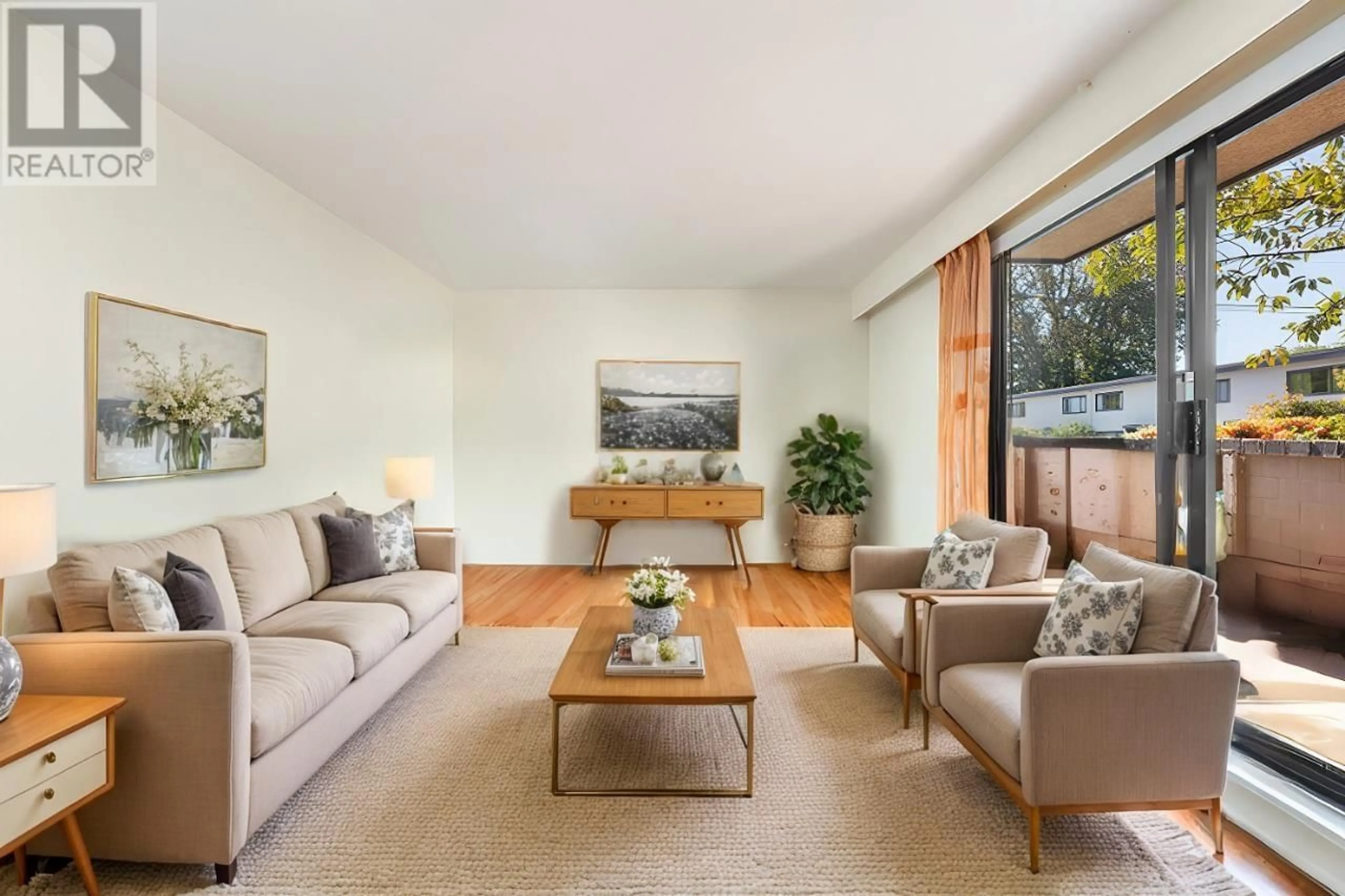 Living room with furniture, wood/laminate floor for 112 2222 CAMBRIDGE STREET, Vancouver British Columbia V5L1E6