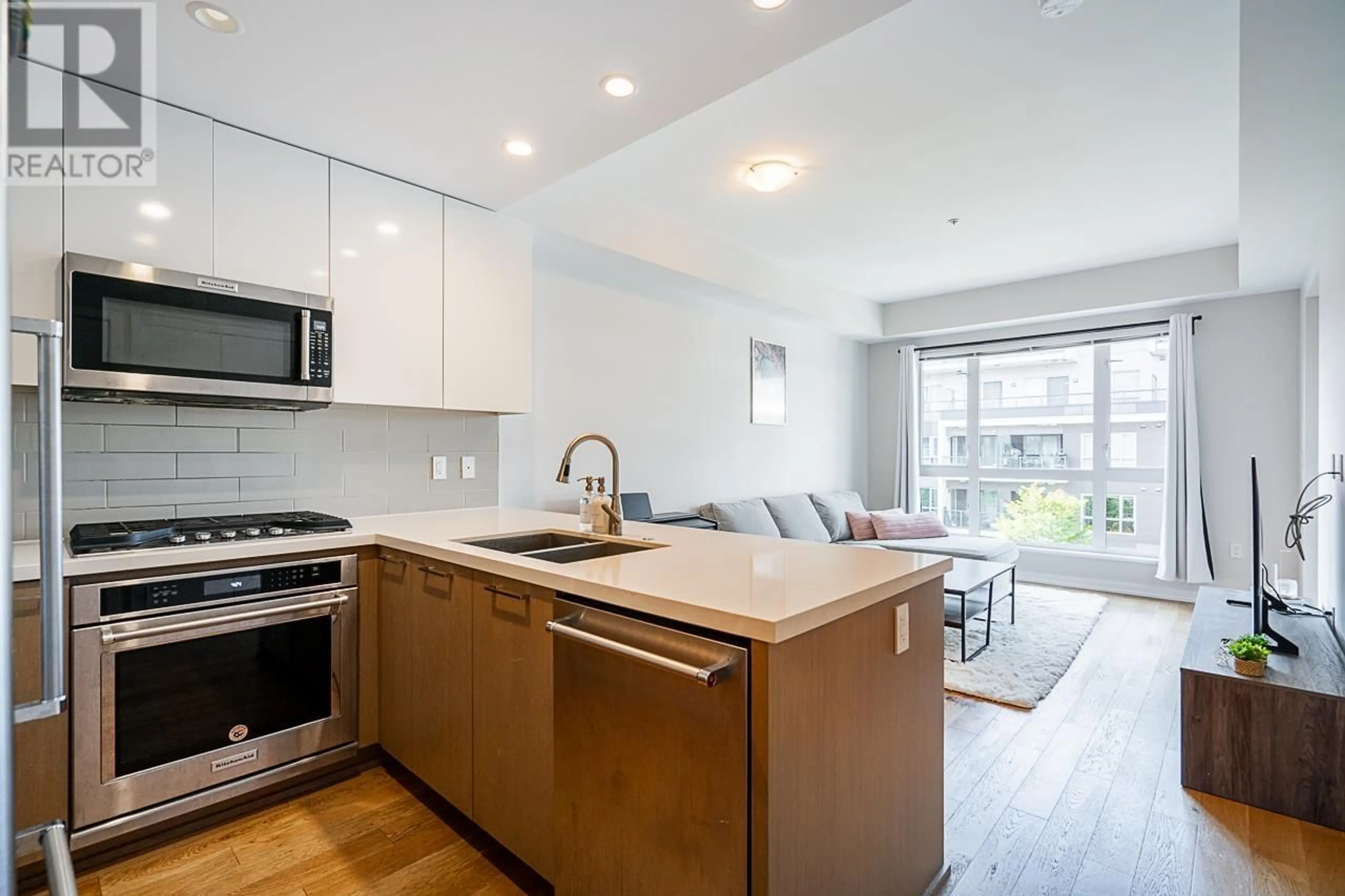 Open concept kitchen, wood/laminate floor for 521 - 7008 RIVER PARKWAY, Richmond British Columbia V6X0R1
