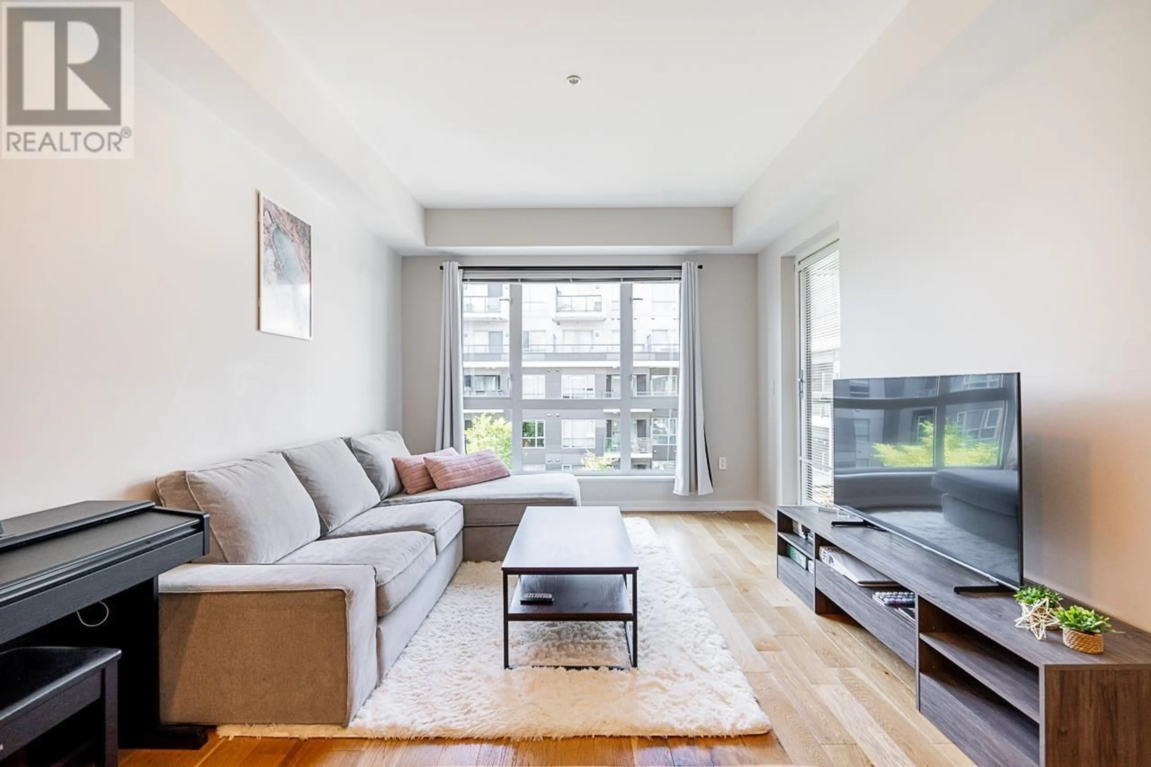 Living room with furniture, wood/laminate floor for 521 - 7008 RIVER PARKWAY, Richmond British Columbia V6X0R1