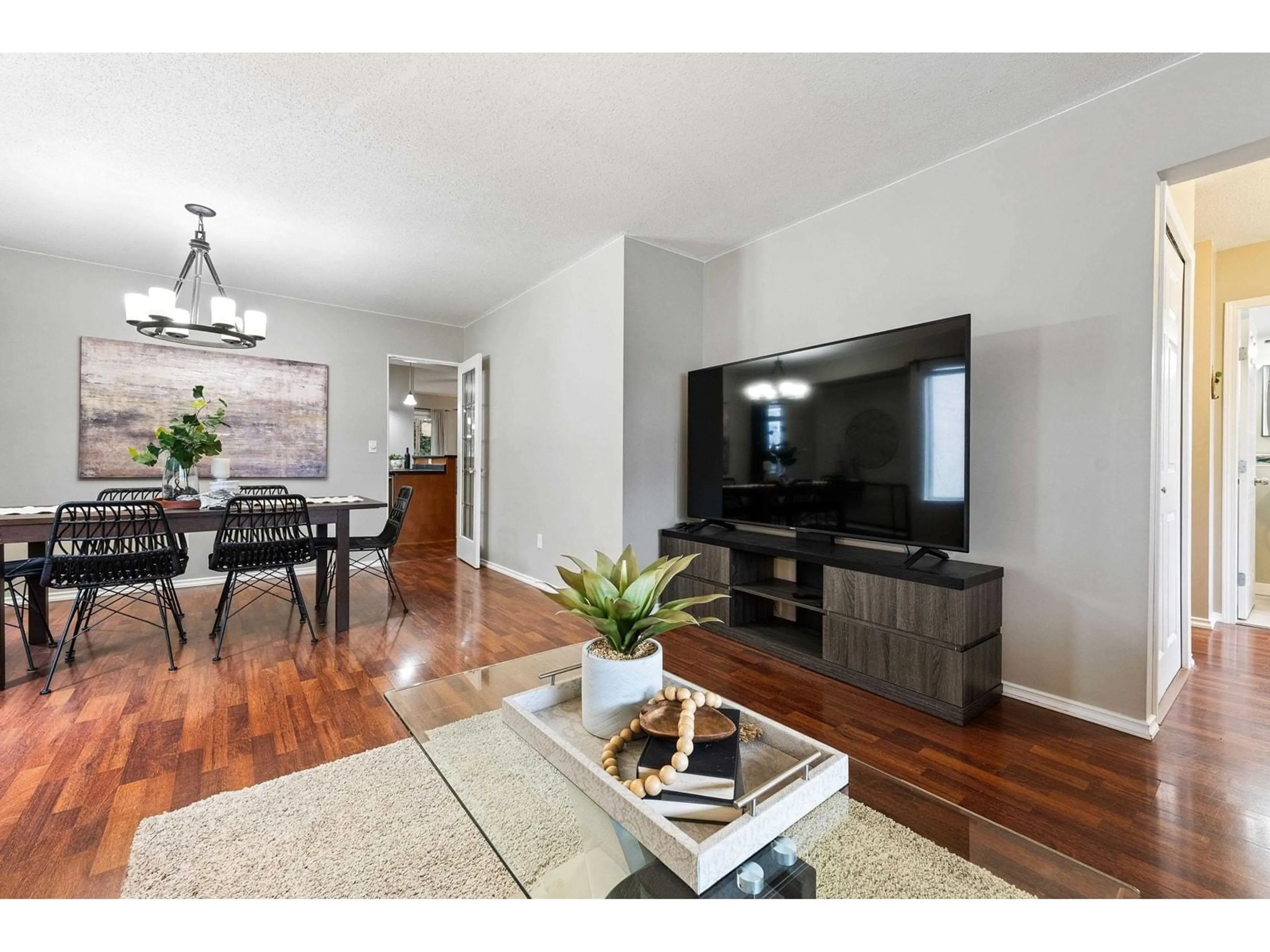 Living room with furniture, wood/laminate floor for 7211 CIRCLE DRIVE, Chilliwack British Columbia V2R2S6