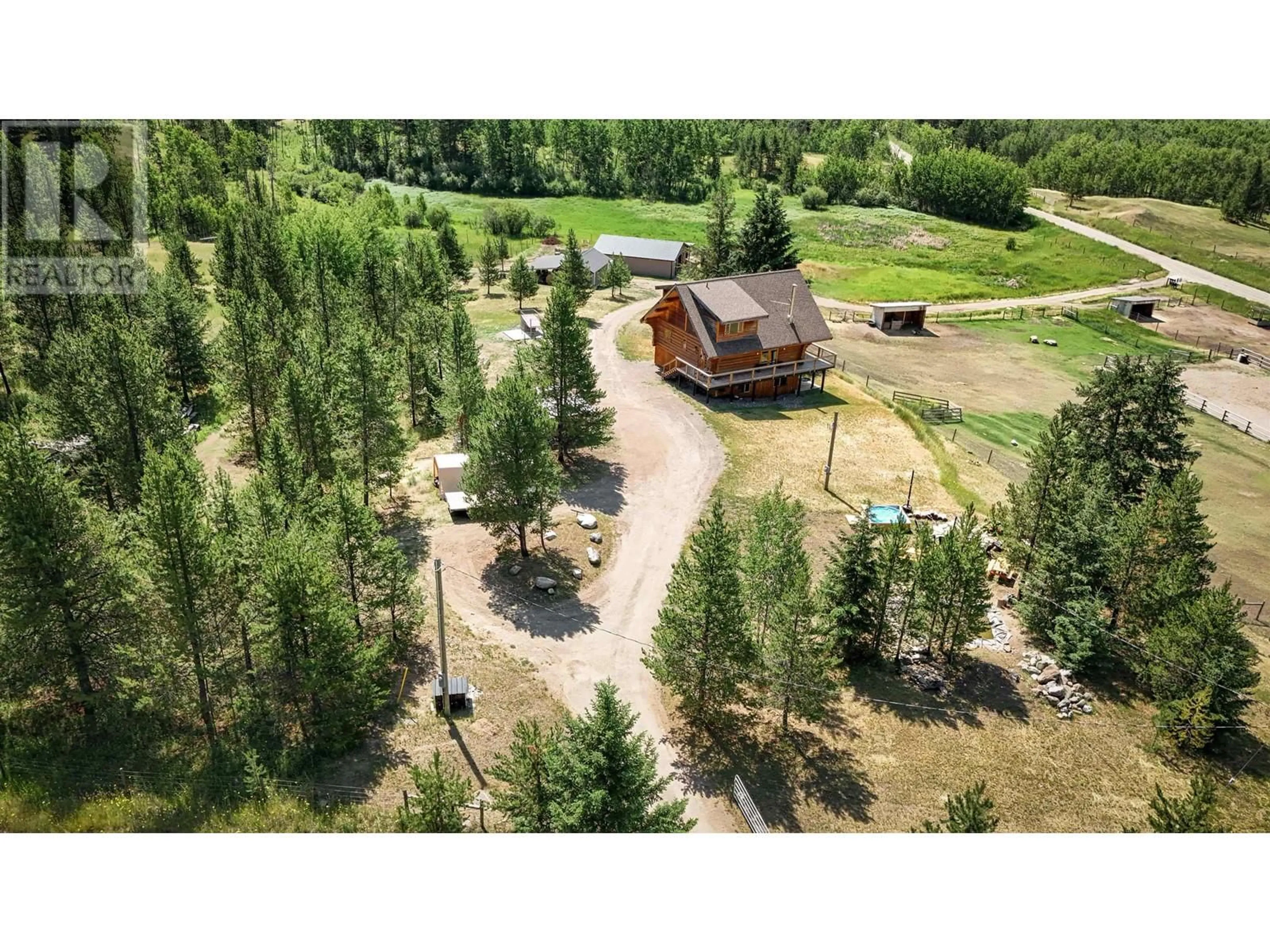 A pic from outside/outdoor area/front of a property/back of a property/a pic from drone, forest/trees view for 5289 DAWSON ROAD, 100 Mile House British Columbia V0K2E1