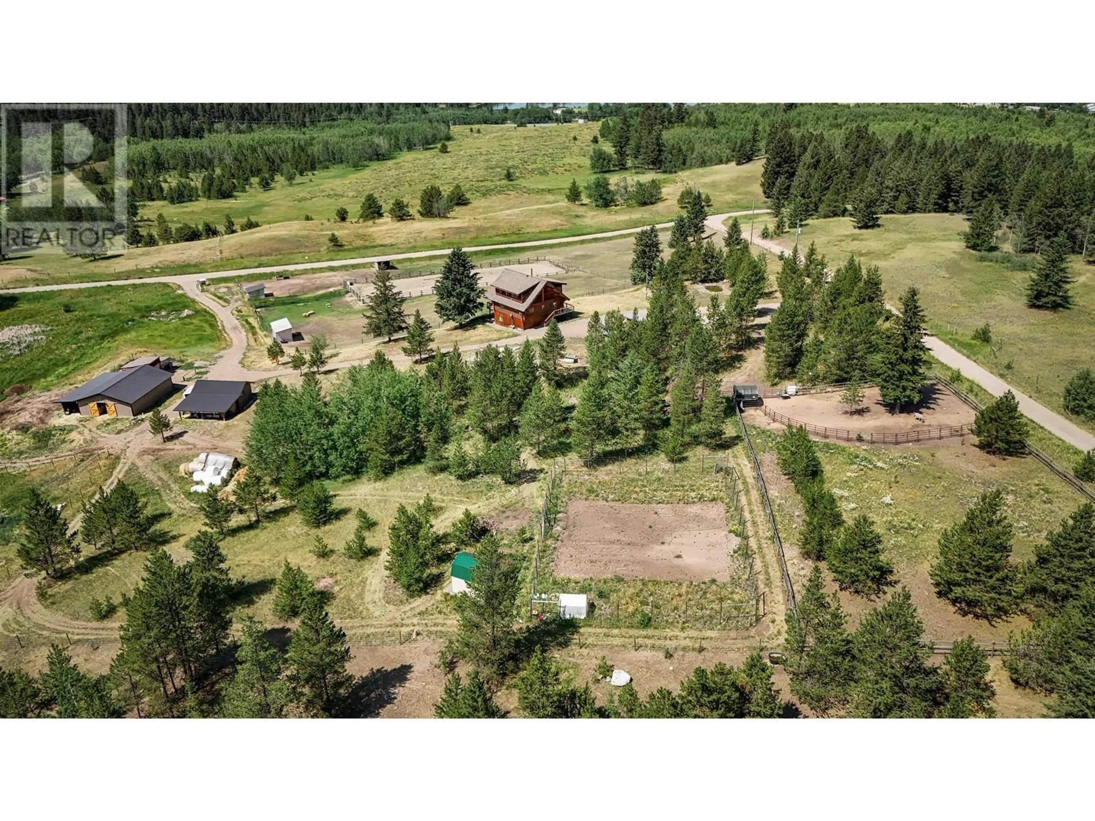 A pic from outside/outdoor area/front of a property/back of a property/a pic from drone, forest/trees view for 5289 DAWSON ROAD, 100 Mile House British Columbia V0K2E1