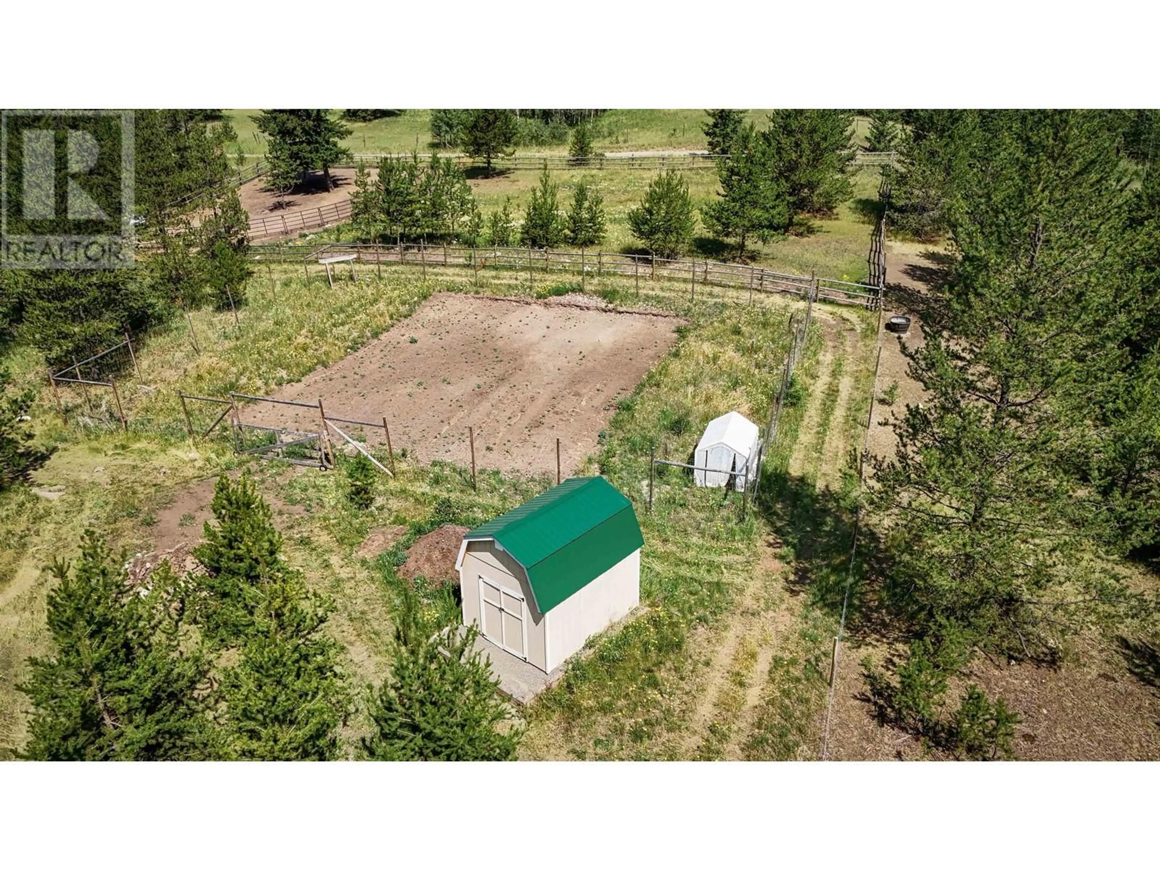 A pic from outside/outdoor area/front of a property/back of a property/a pic from drone, forest/trees view for 5289 DAWSON ROAD, 100 Mile House British Columbia V0K2E1