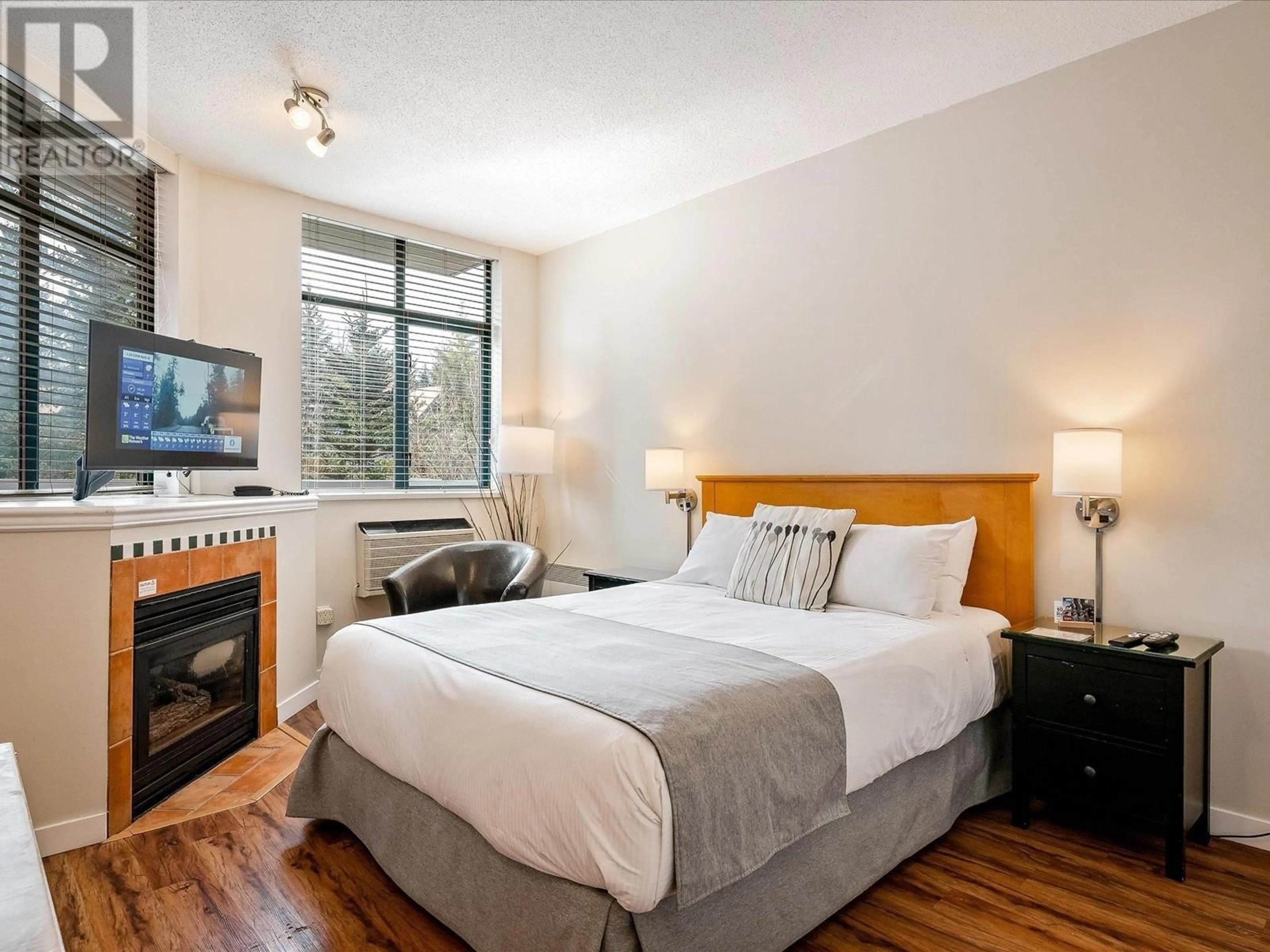 Bedroom with bed, wood/laminate floor for 210 - 4369 MAIN STREET, Whistler British Columbia V8E1B7