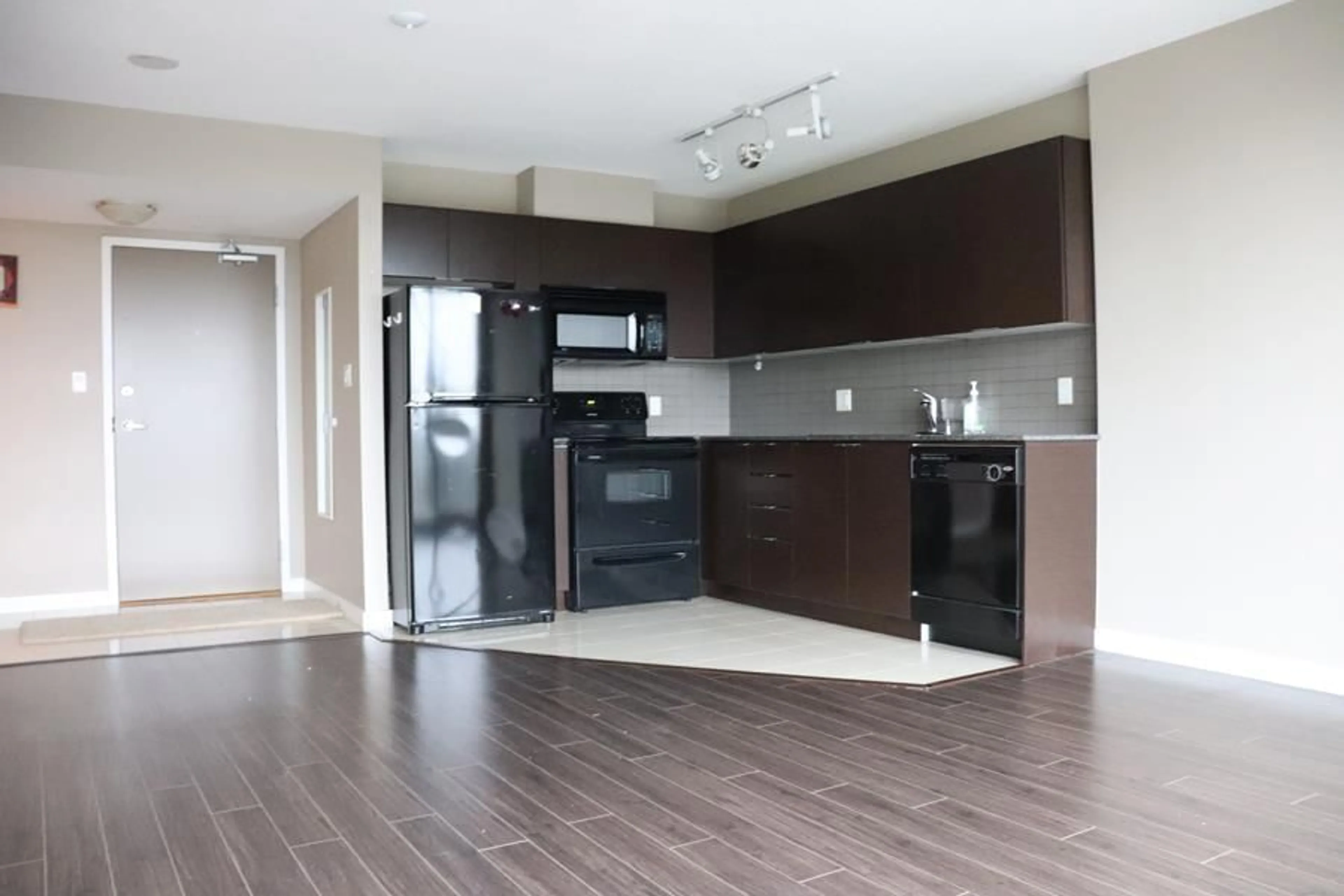 Open concept kitchen, wood/laminate floor for 1110 - 13618 100, Surrey British Columbia V3T0A8