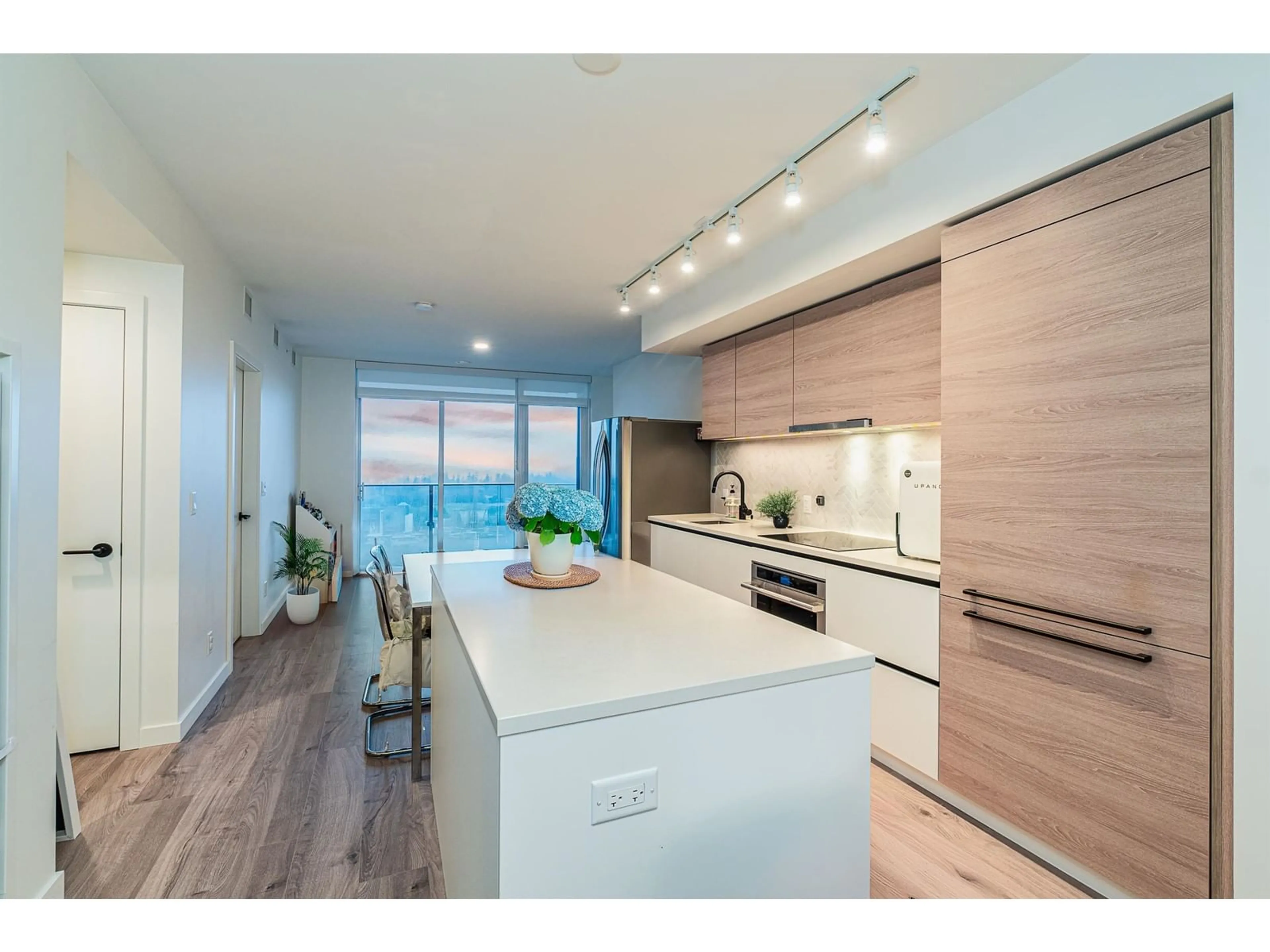 Open concept kitchen, wood/laminate floor for 2501 - 13428 105, Surrey British Columbia V3T4B2