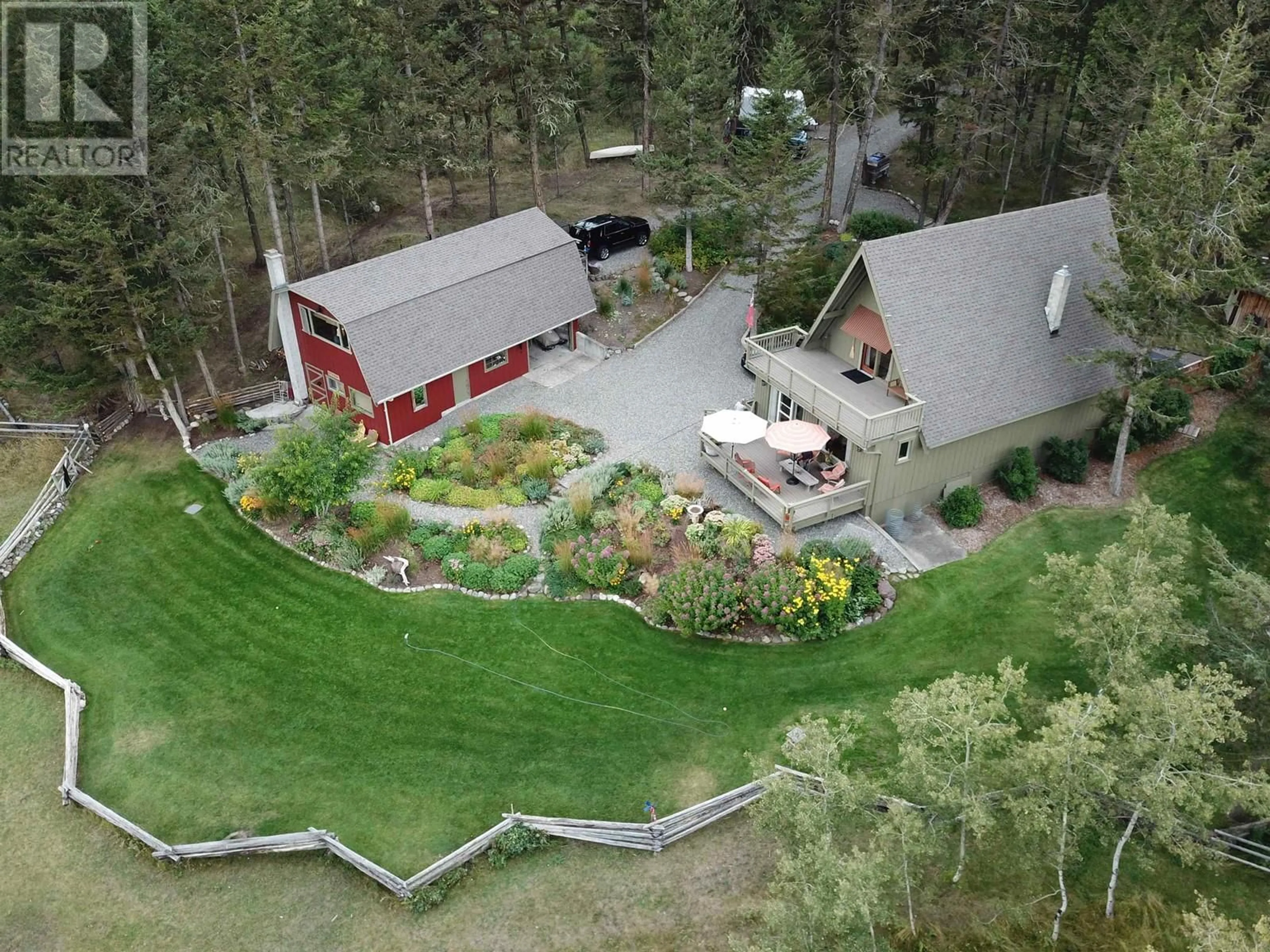 A pic from outside/outdoor area/front of a property/back of a property/a pic from drone, mountain view for 5058 BLOCK DRIVE, 108 Mile Ranch British Columbia V0K2Z0