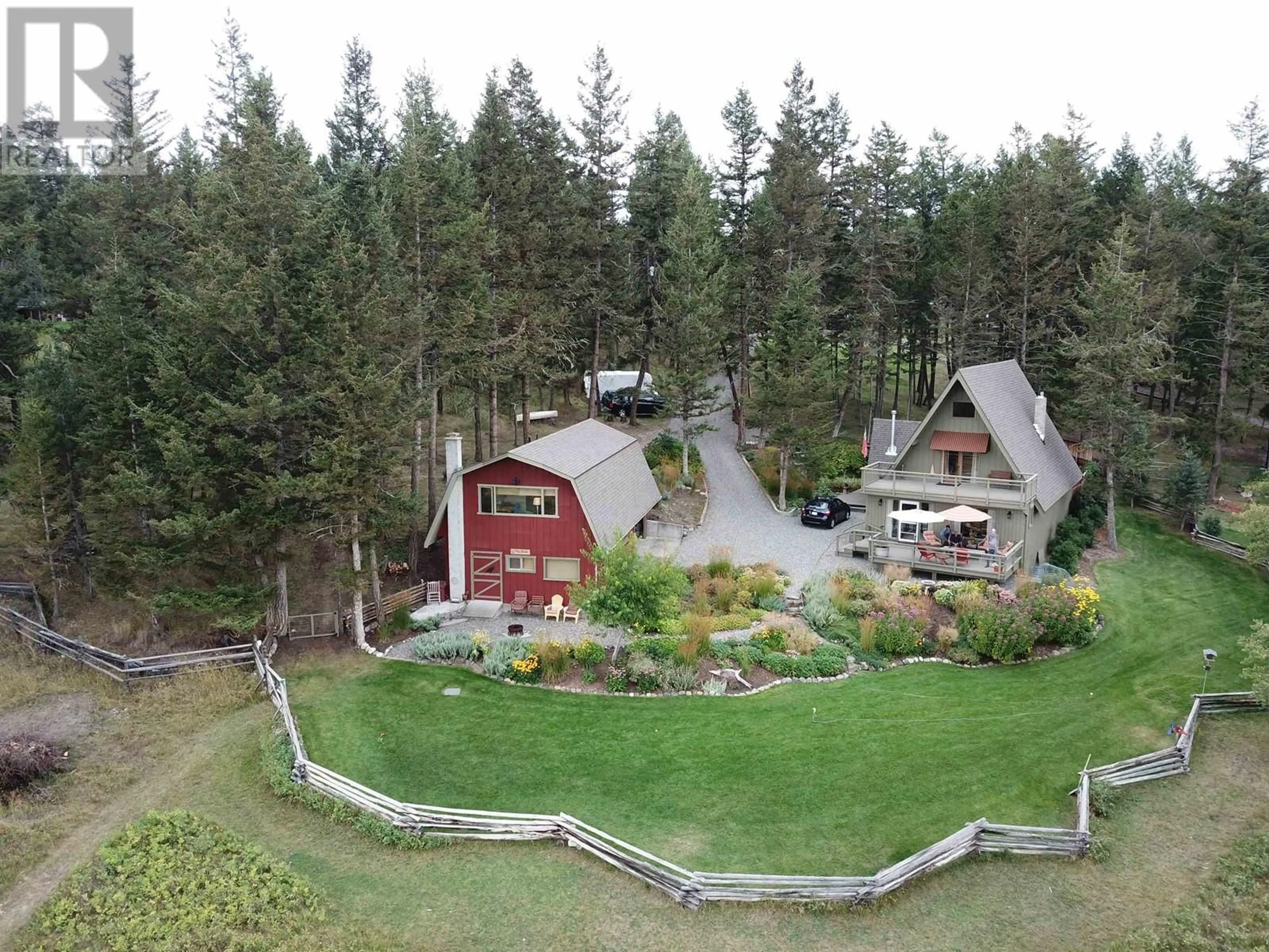 A pic from outside/outdoor area/front of a property/back of a property/a pic from drone, mountain view for 5058 BLOCK DRIVE, 108 Mile Ranch British Columbia V0K2Z0