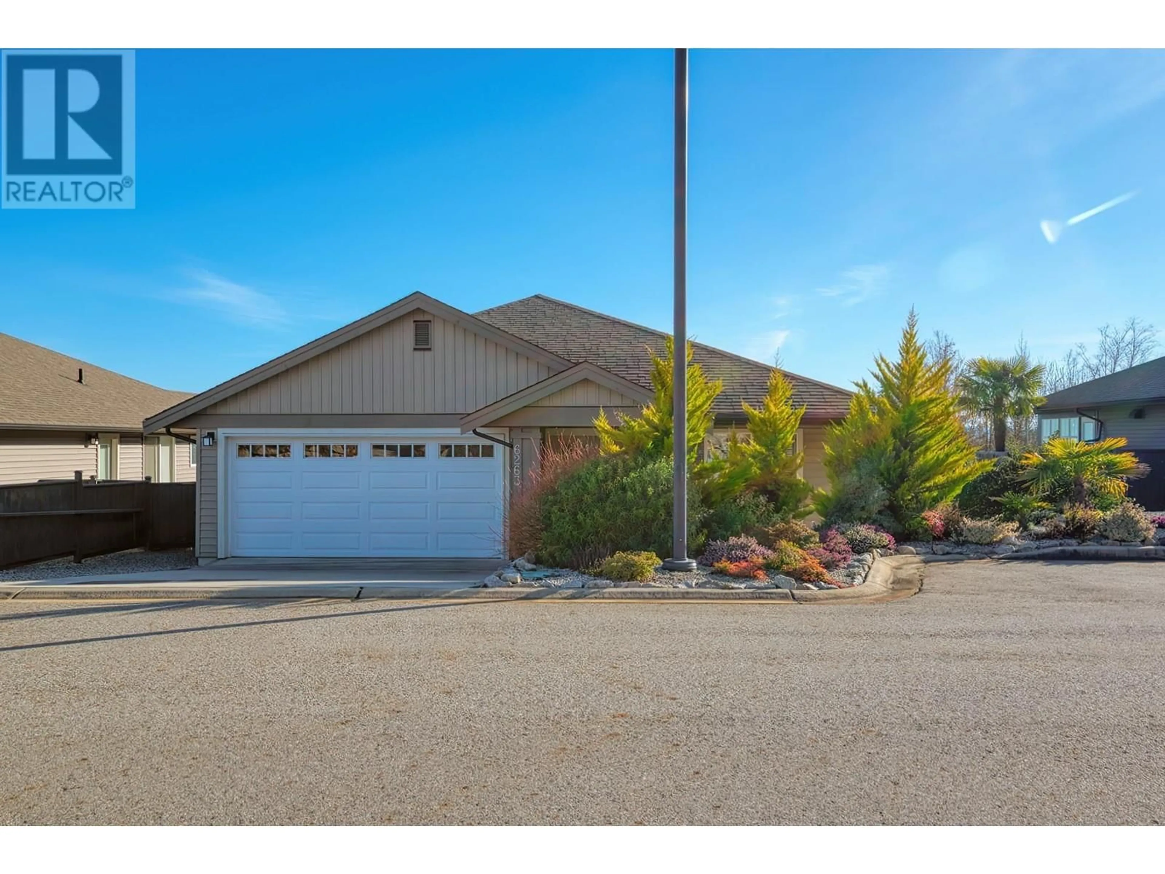 Home with vinyl exterior material, street for 6263 APOLLO ROAD, Sechelt British Columbia V7Z0N7