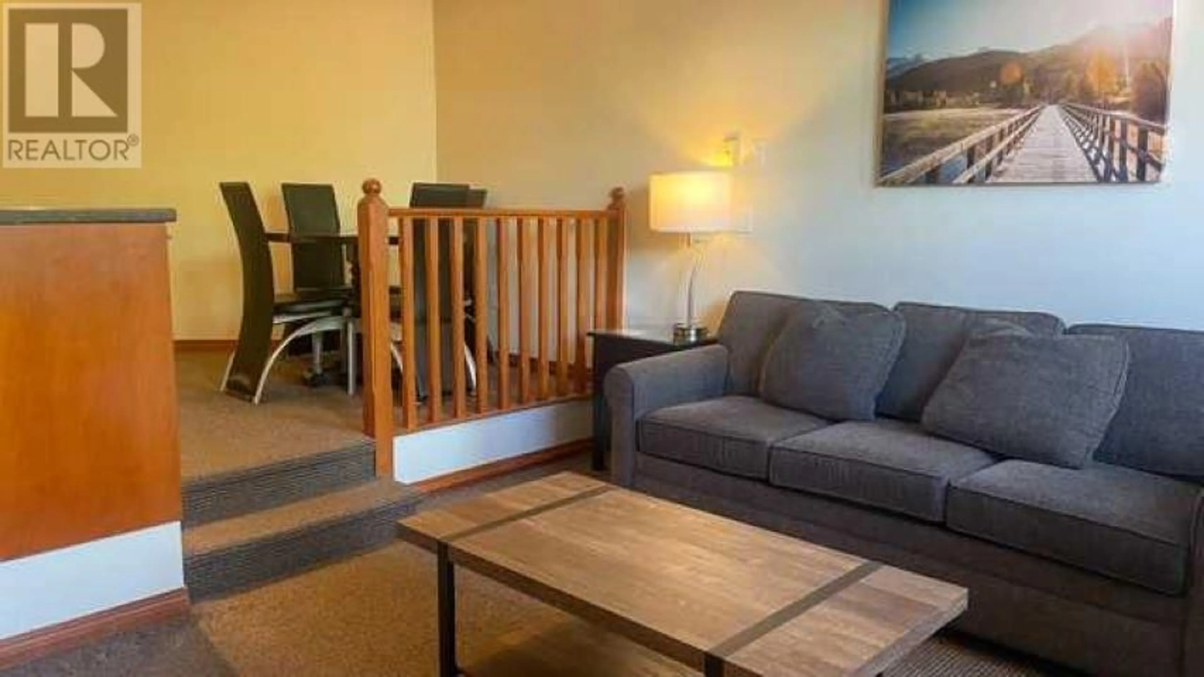 Living room with furniture, wood/laminate floor for 221 4369 MAIN STREET, Whistler British Columbia V8E1B7