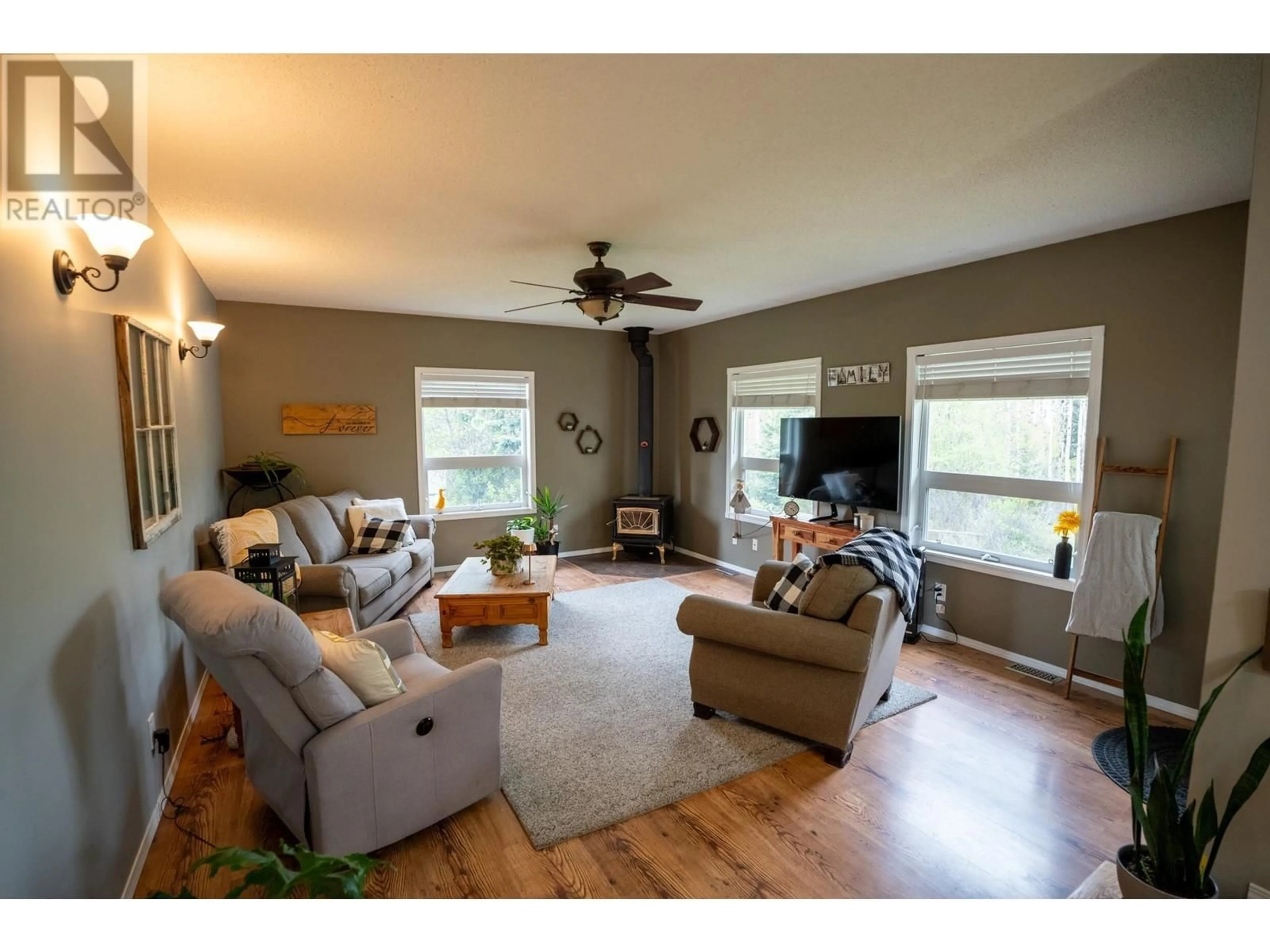 Living room with furniture, wood/laminate floor for 9925 MUSA ROAD, Prince George British Columbia V2N5A9