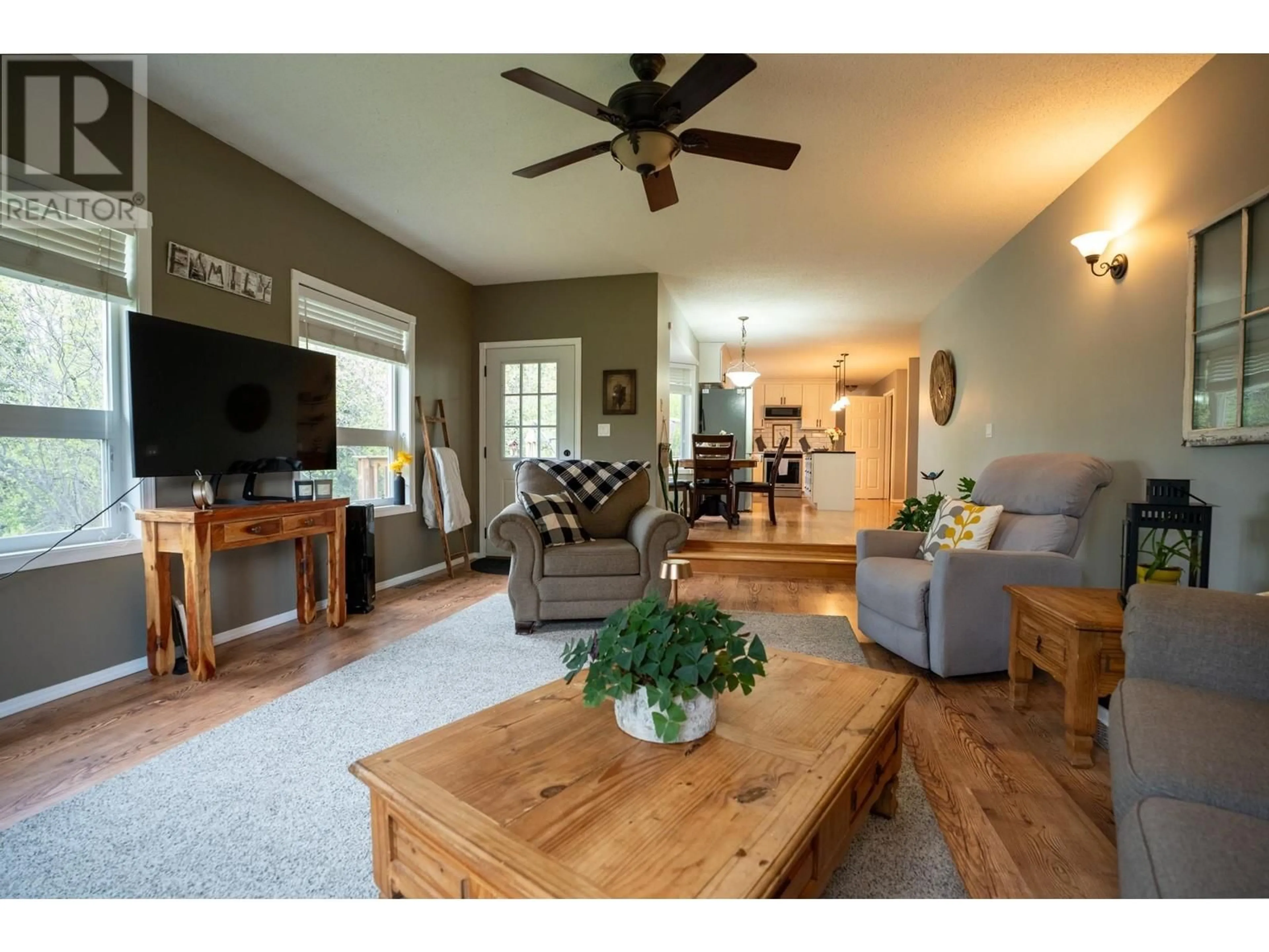 Living room with furniture, wood/laminate floor for 9925 MUSA ROAD, Prince George British Columbia V2N5A9