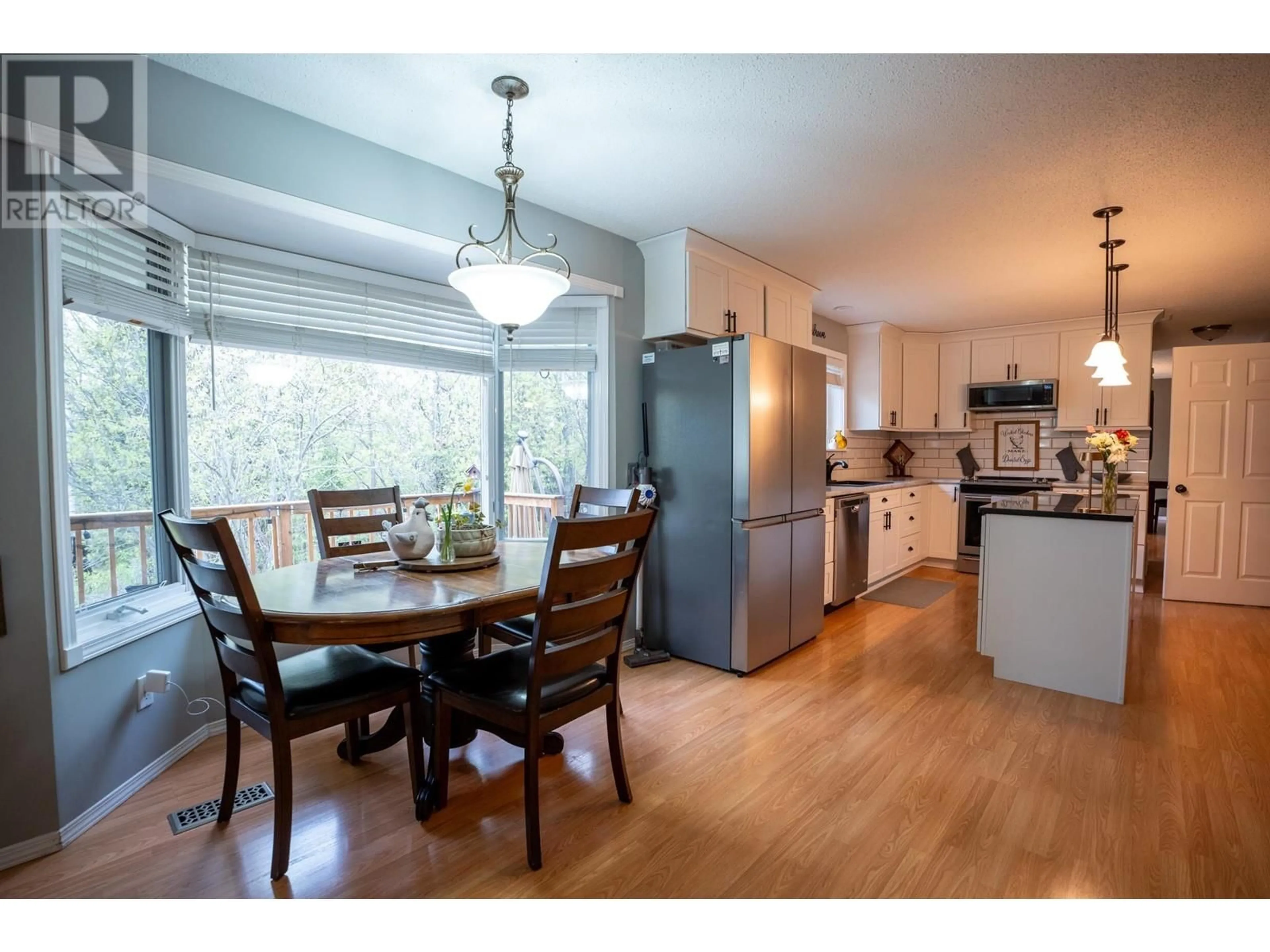 Open concept kitchen, wood/laminate floor for 9925 MUSA ROAD, Prince George British Columbia V2N5A9