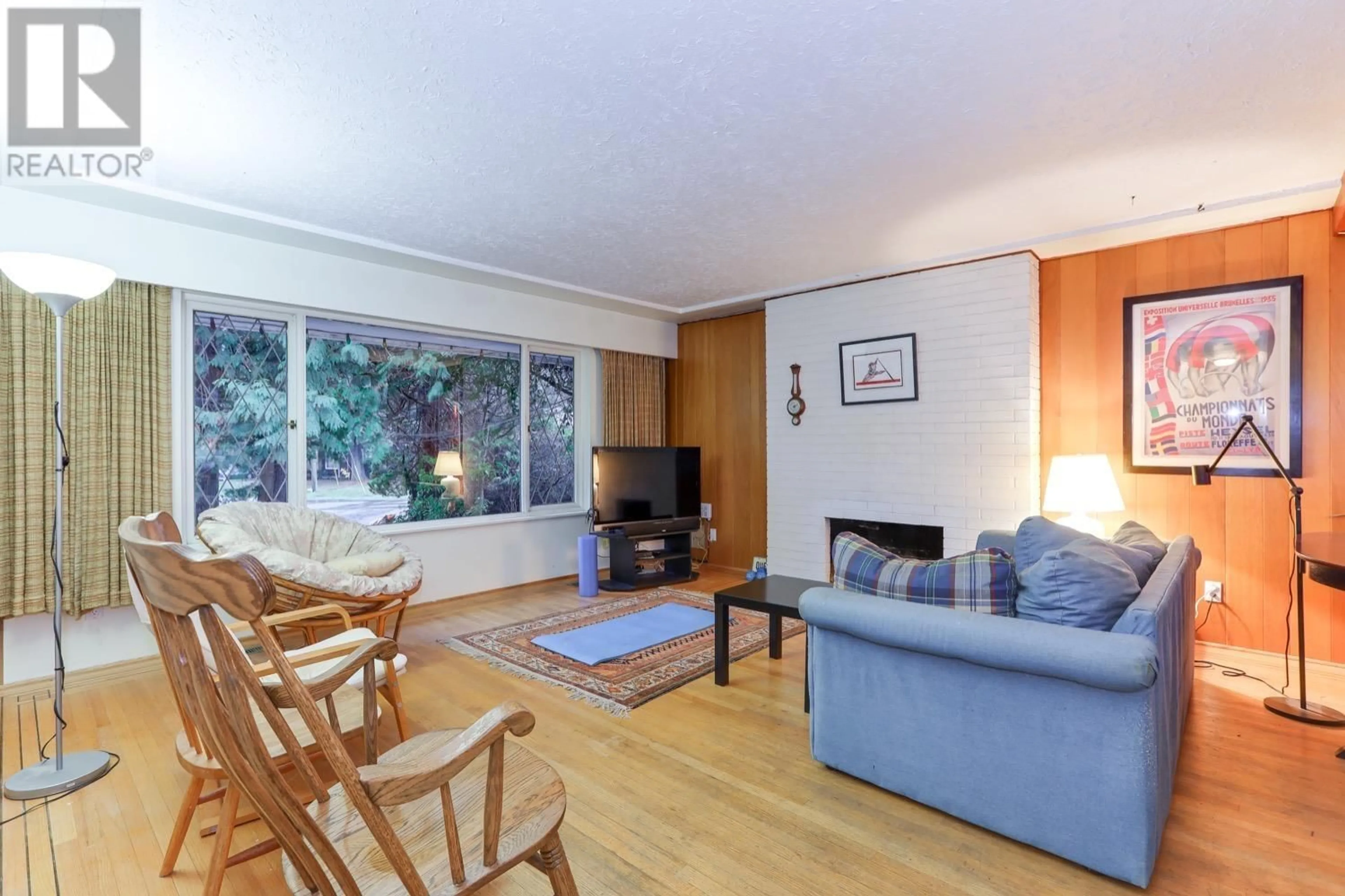 Living room with furniture, wood/laminate floor for 1100 WILMINGTON DRIVE, Delta British Columbia V4M2S4
