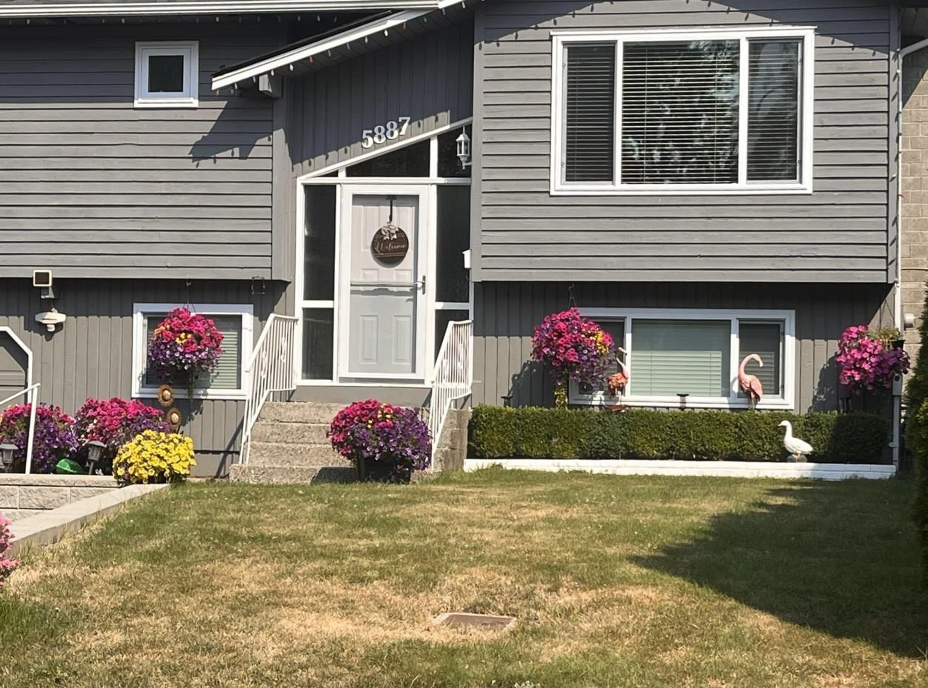 Home with vinyl exterior material, street for 5887 184B STREET, Surrey British Columbia V3S5S9