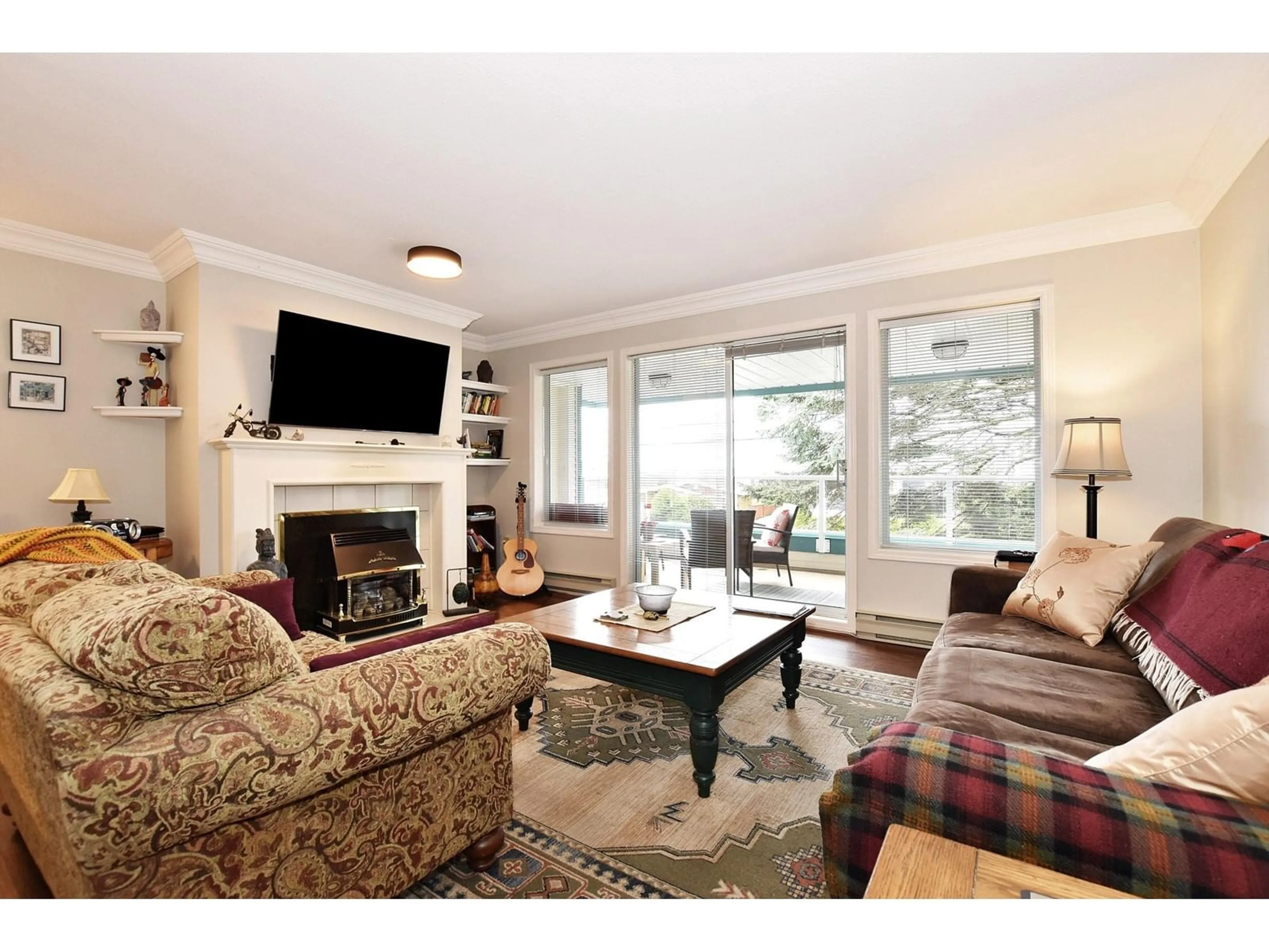 Living room with furniture, wood/laminate floor for 402 - 7500 COLUMBIA, Mission British Columbia V2V4C1