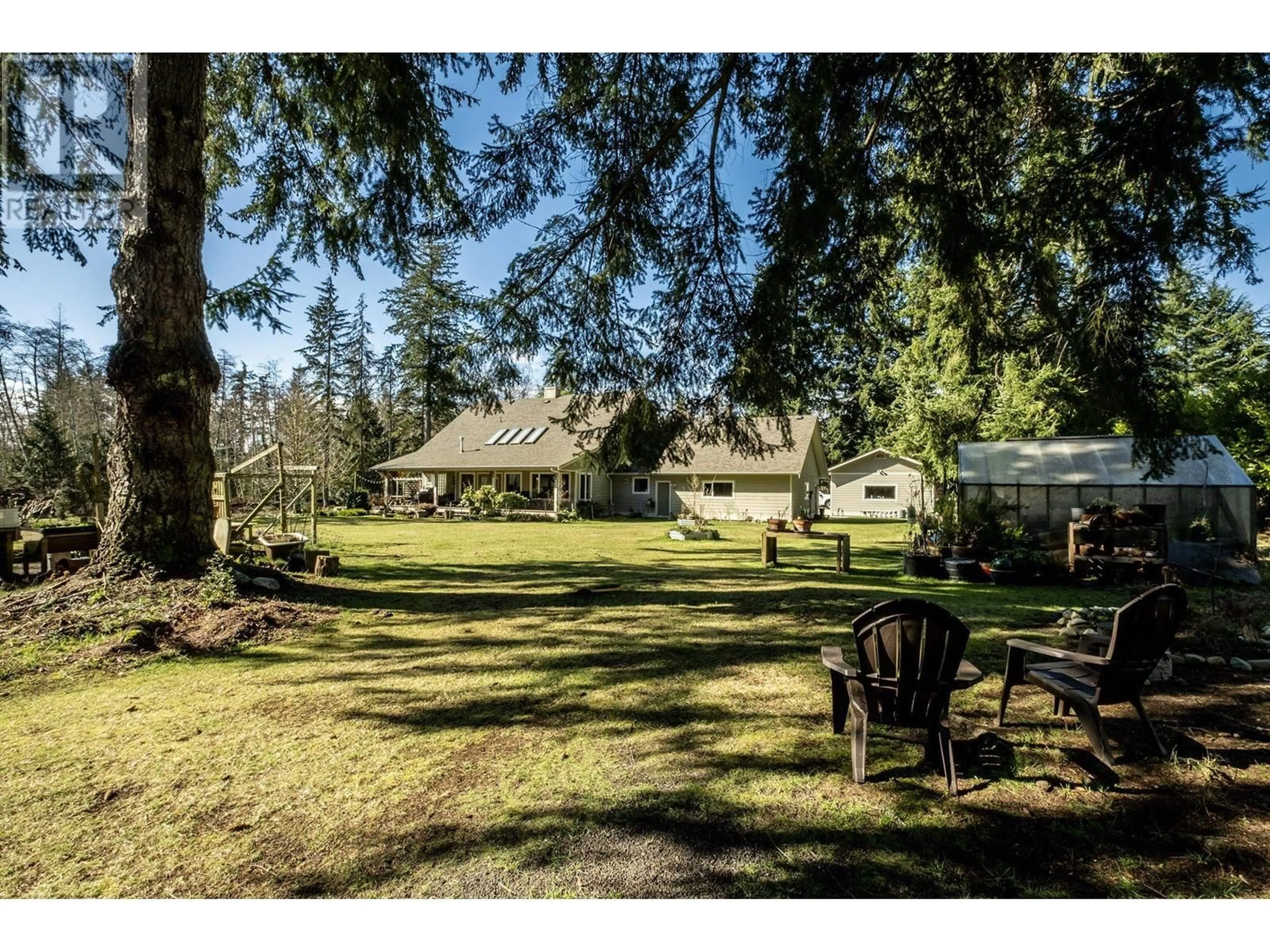 A pic from outside/outdoor area/front of a property/back of a property/a pic from drone, forest/trees view for 462 VETERANS ROAD, Gibsons British Columbia V0N1V4