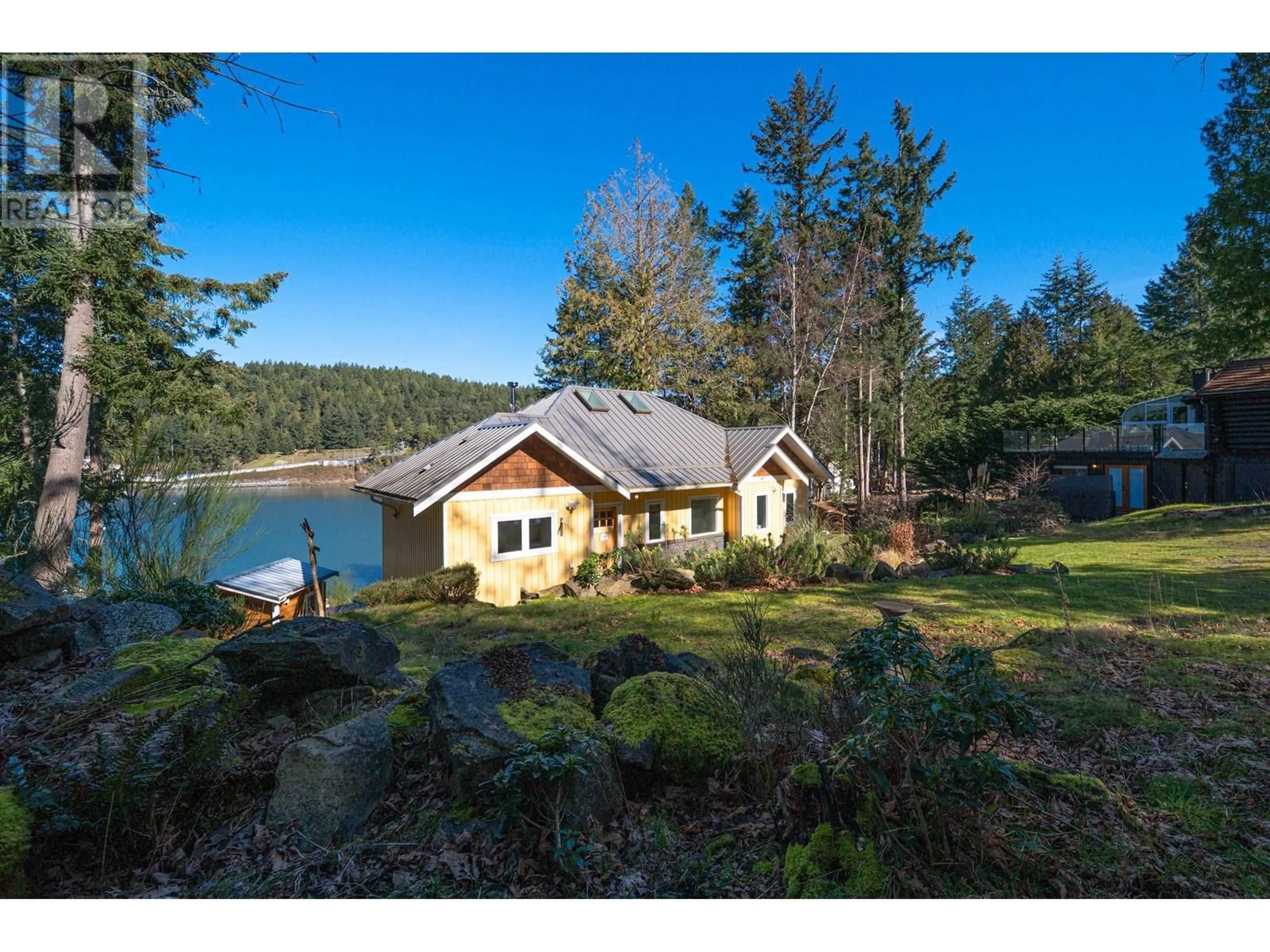 A pic from outside/outdoor area/front of a property/back of a property/a pic from drone, water/lake/river/ocean view for 225 MARINERS WAY, Mayne Island British Columbia V0N2J2