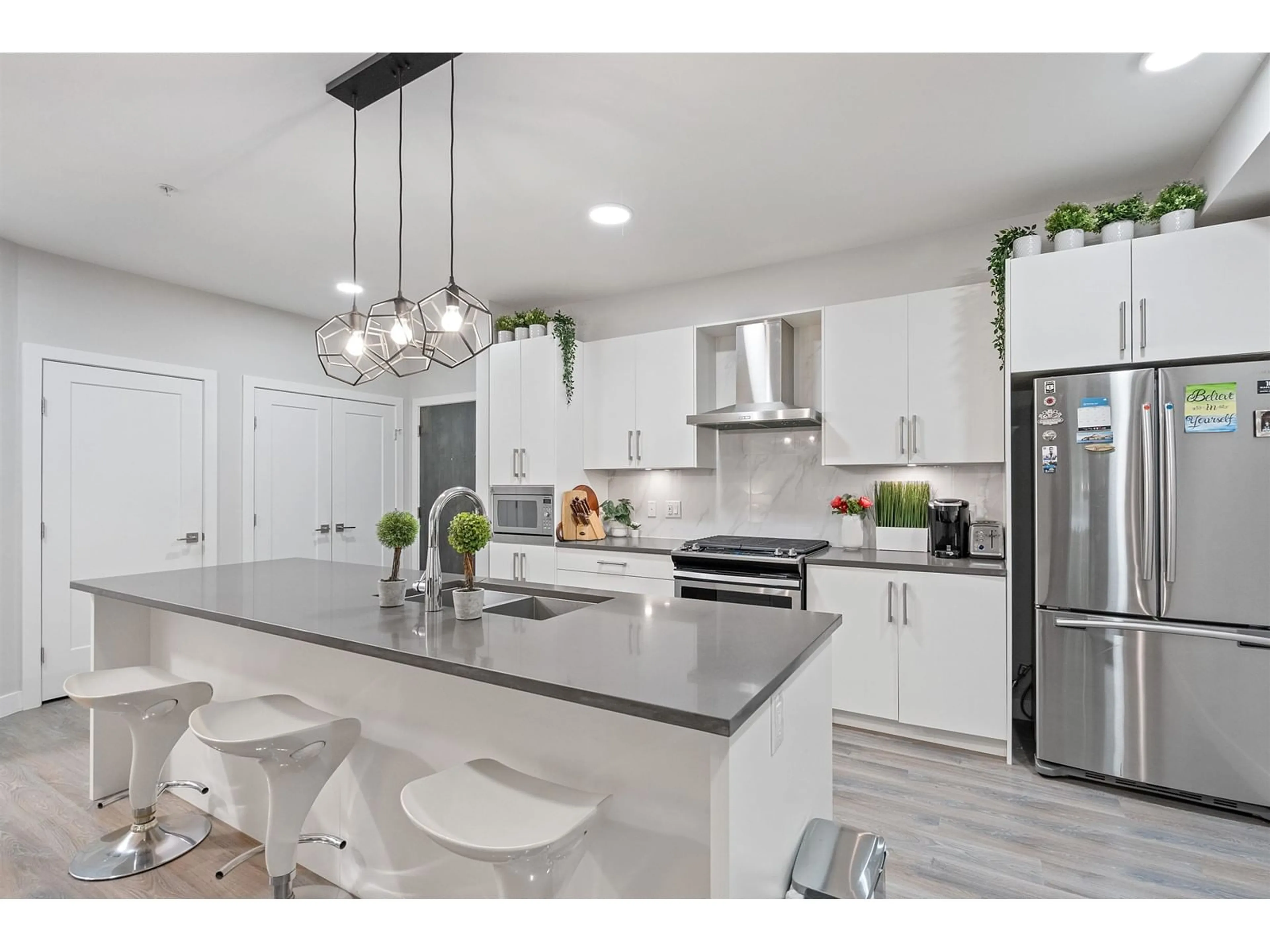 Open concept kitchen, ceramic/tile floor for 110 - 15436 31, Surrey British Columbia V3Z1H3