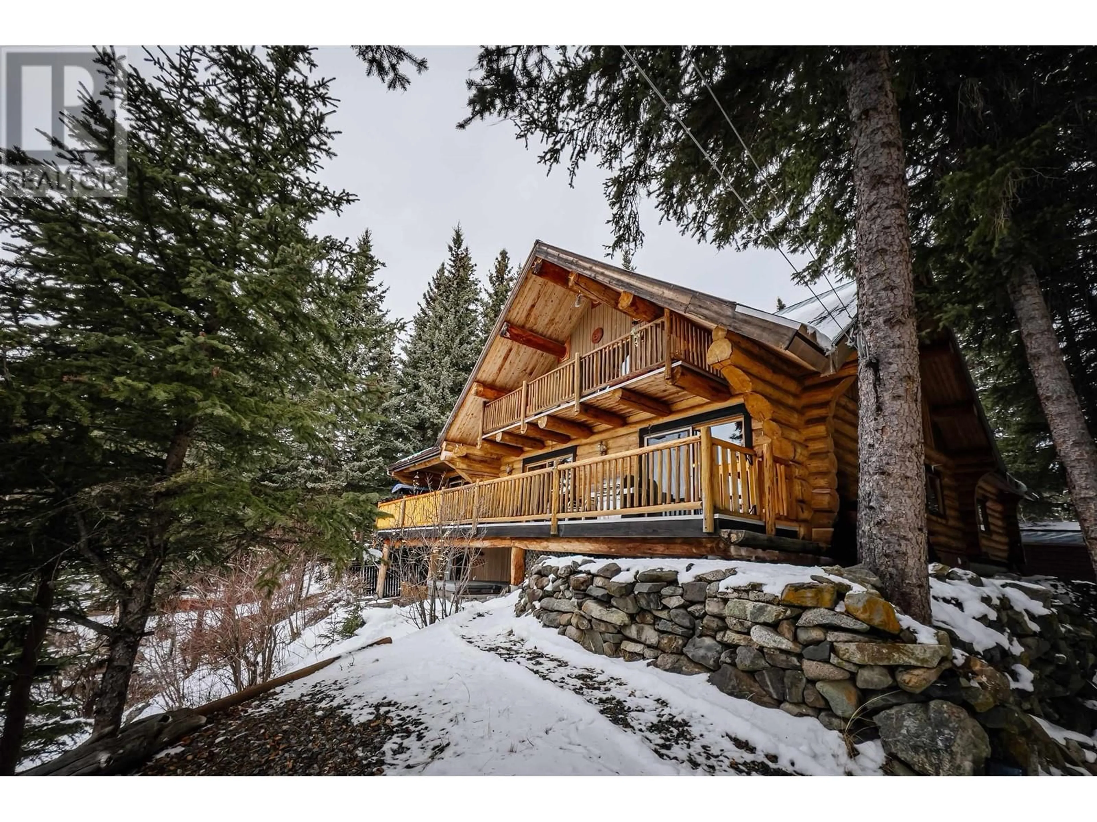 A pic from outside/outdoor area/front of a property/back of a property/a pic from drone, water/lake/river/ocean view for 8494 GERALD CRESCENT, 100 Mile House British Columbia V0K1E0