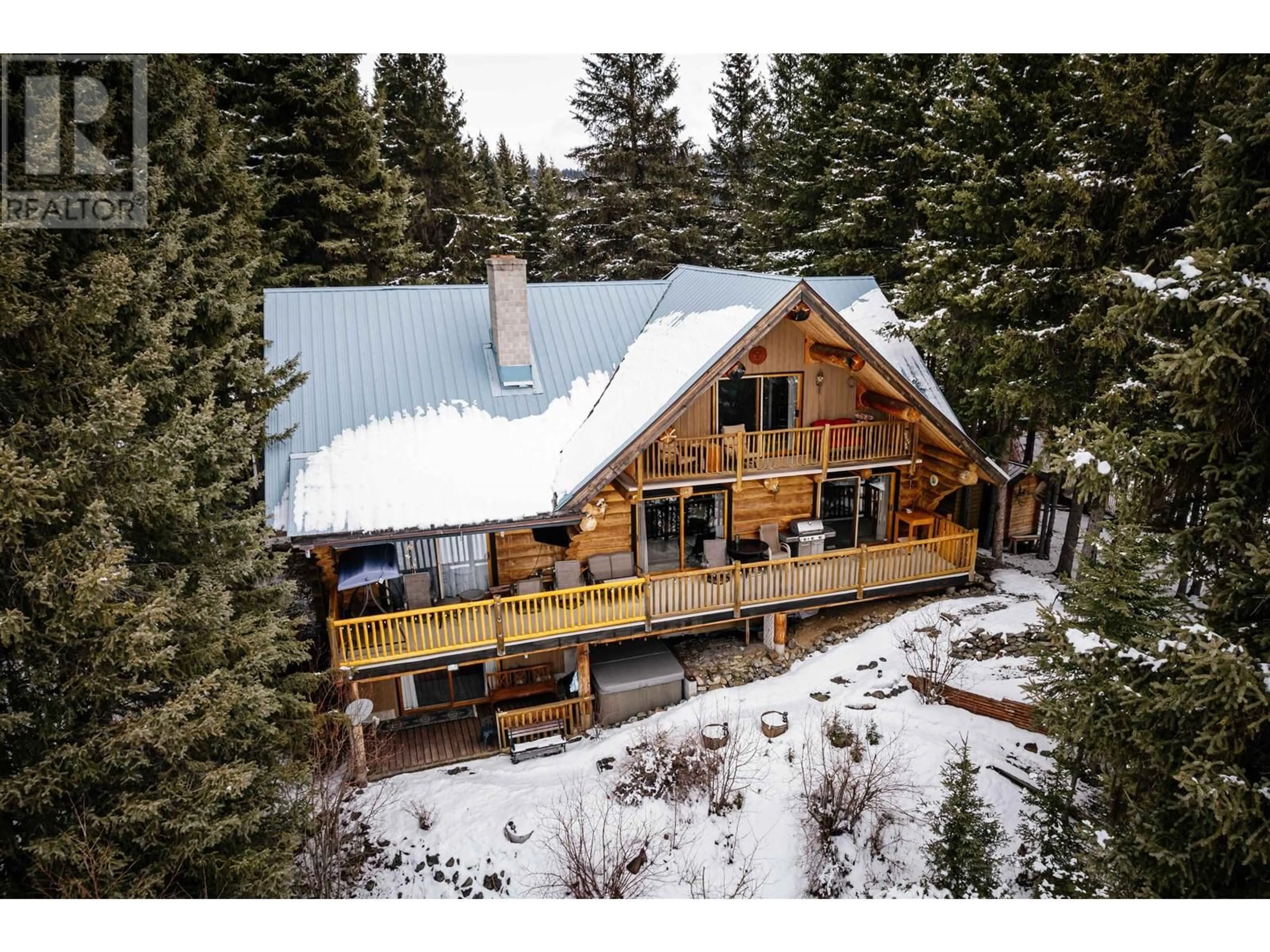 A pic from outside/outdoor area/front of a property/back of a property/a pic from drone, water/lake/river/ocean view for 8494 GERALD CRESCENT, 100 Mile House British Columbia V0K1E0
