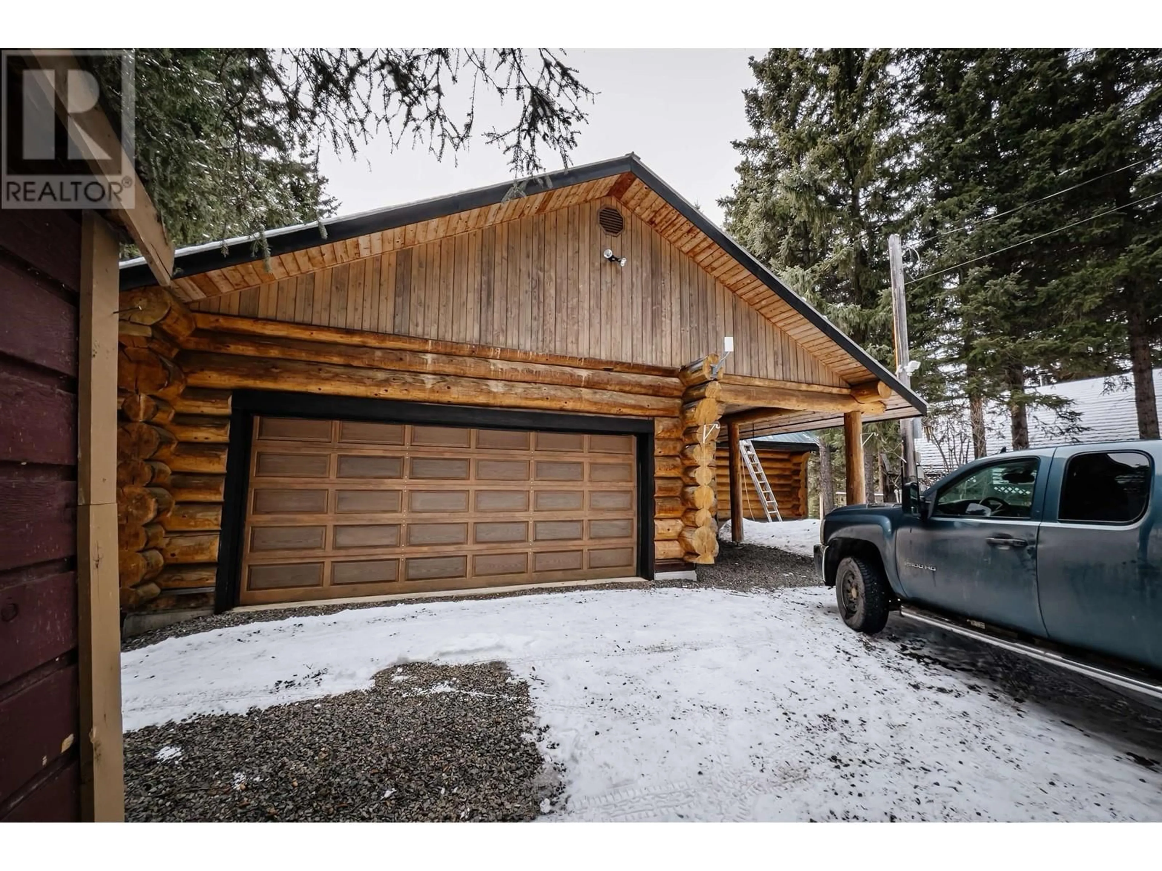 A pic from outside/outdoor area/front of a property/back of a property/a pic from drone, unknown for 8494 GERALD CRESCENT, 100 Mile House British Columbia V0K1E0