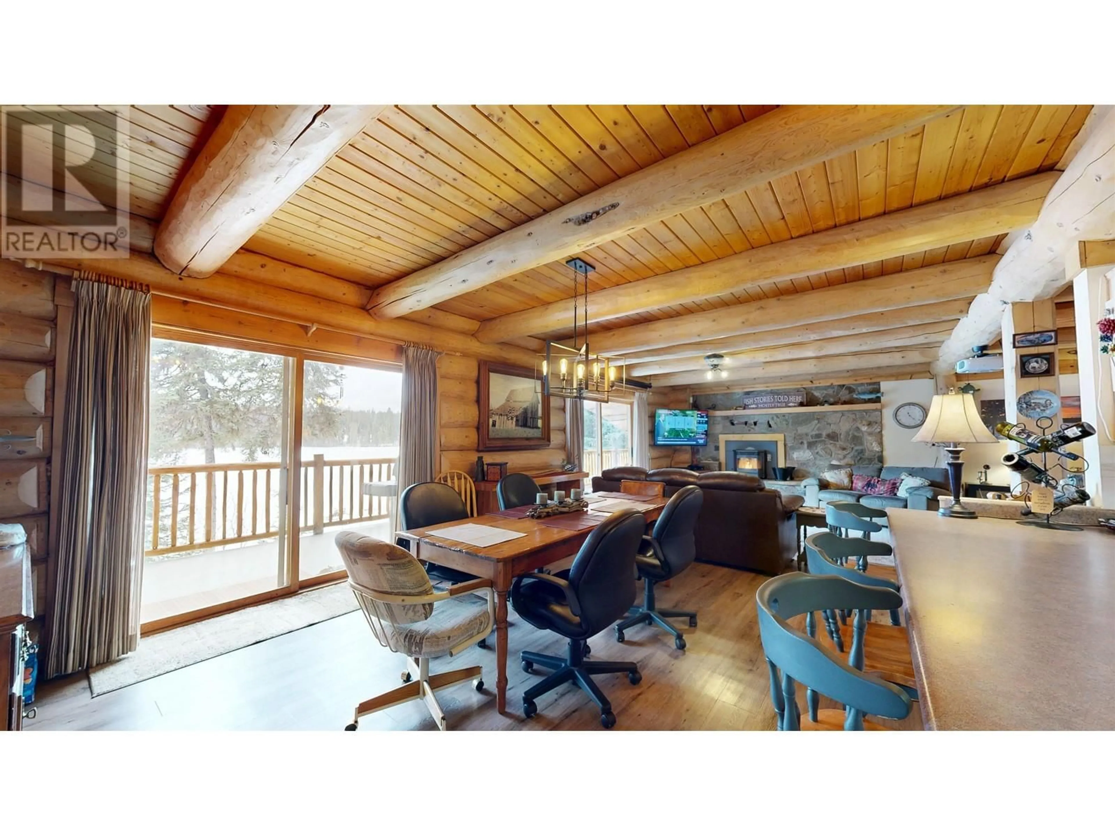 Living room with furniture, wood/laminate floor for 8494 GERALD CRESCENT, 100 Mile House British Columbia V0K1E0