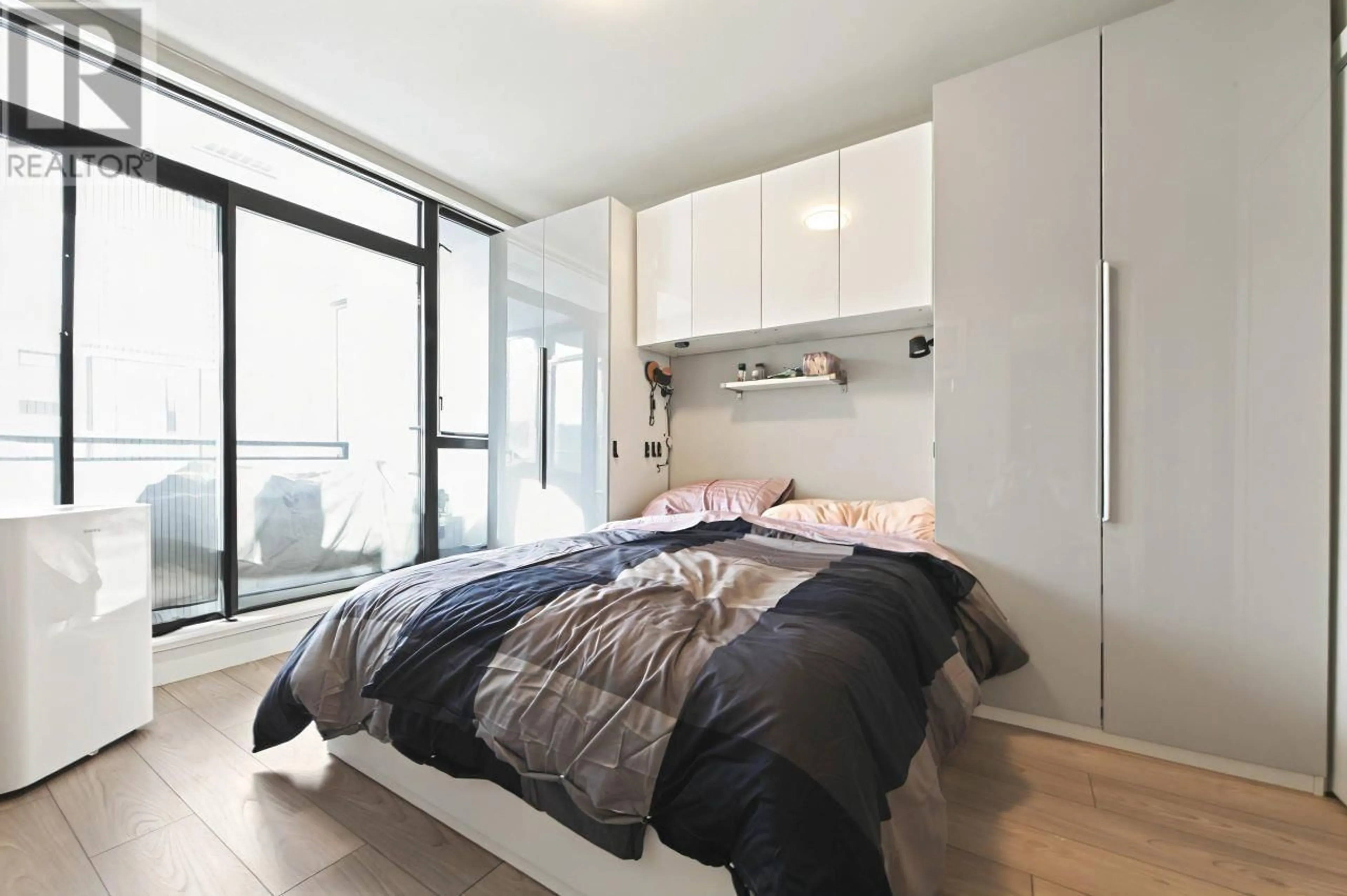 Bedroom with bed, wood/laminate floor for 703 - 110 BREW STREET, Port Moody British Columbia V3H0E4