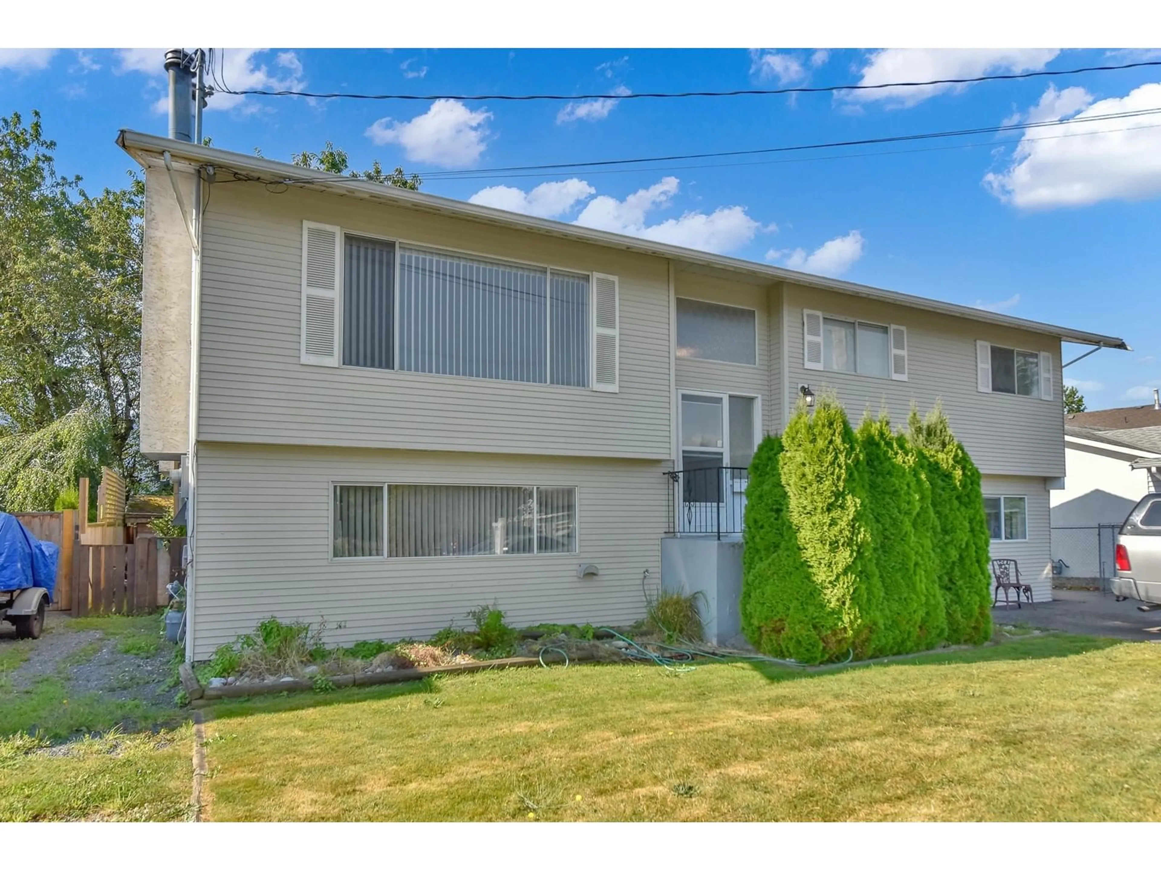 Home with vinyl exterior material, street for 45580 STEVENSON ROAD|Sardis South, Chilliwack British Columbia V2R1M6