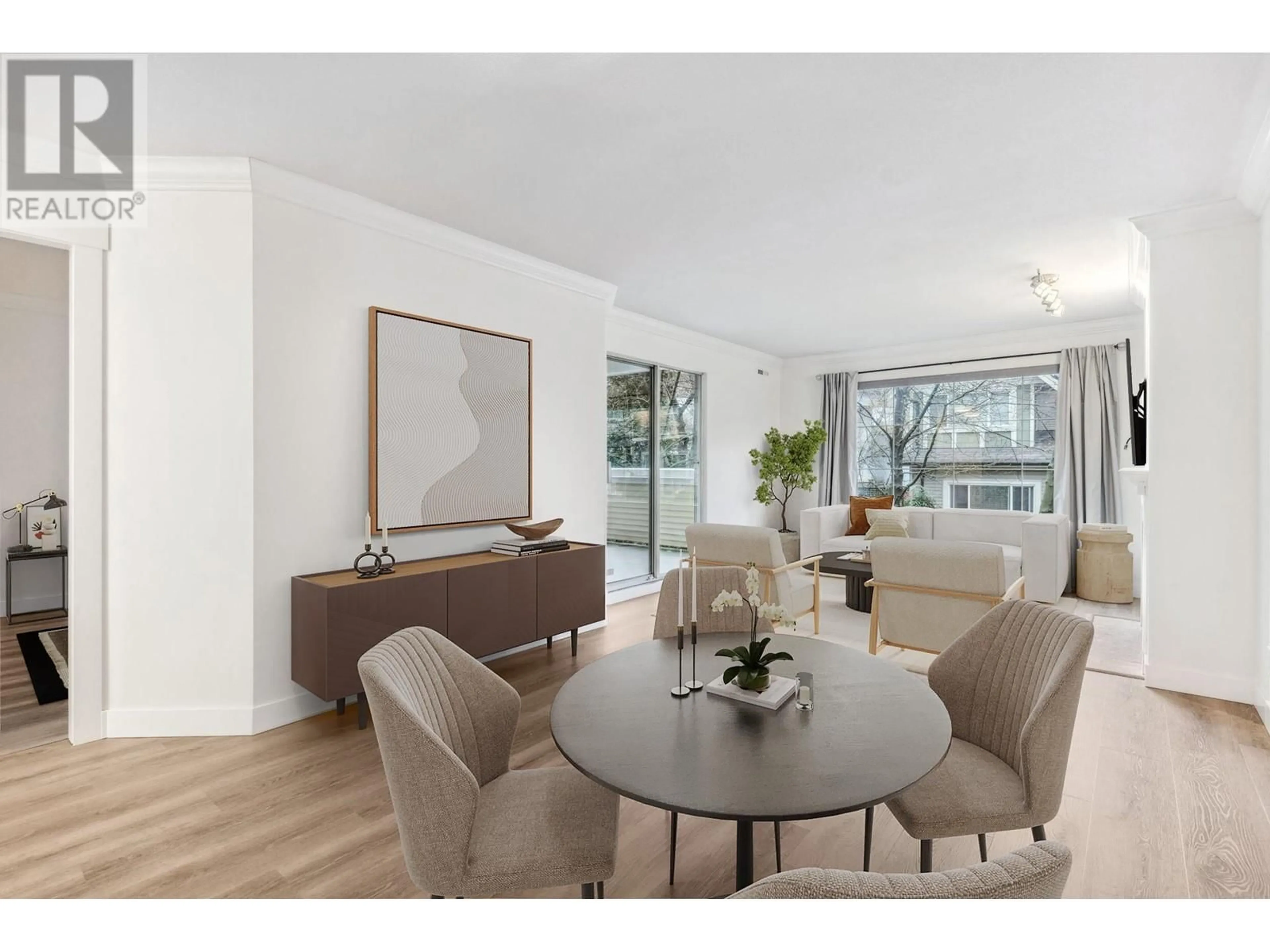 Living room with furniture, wood/laminate floor for 212 - 6820 RUMBLE STREET, Burnaby British Columbia V5E4H9