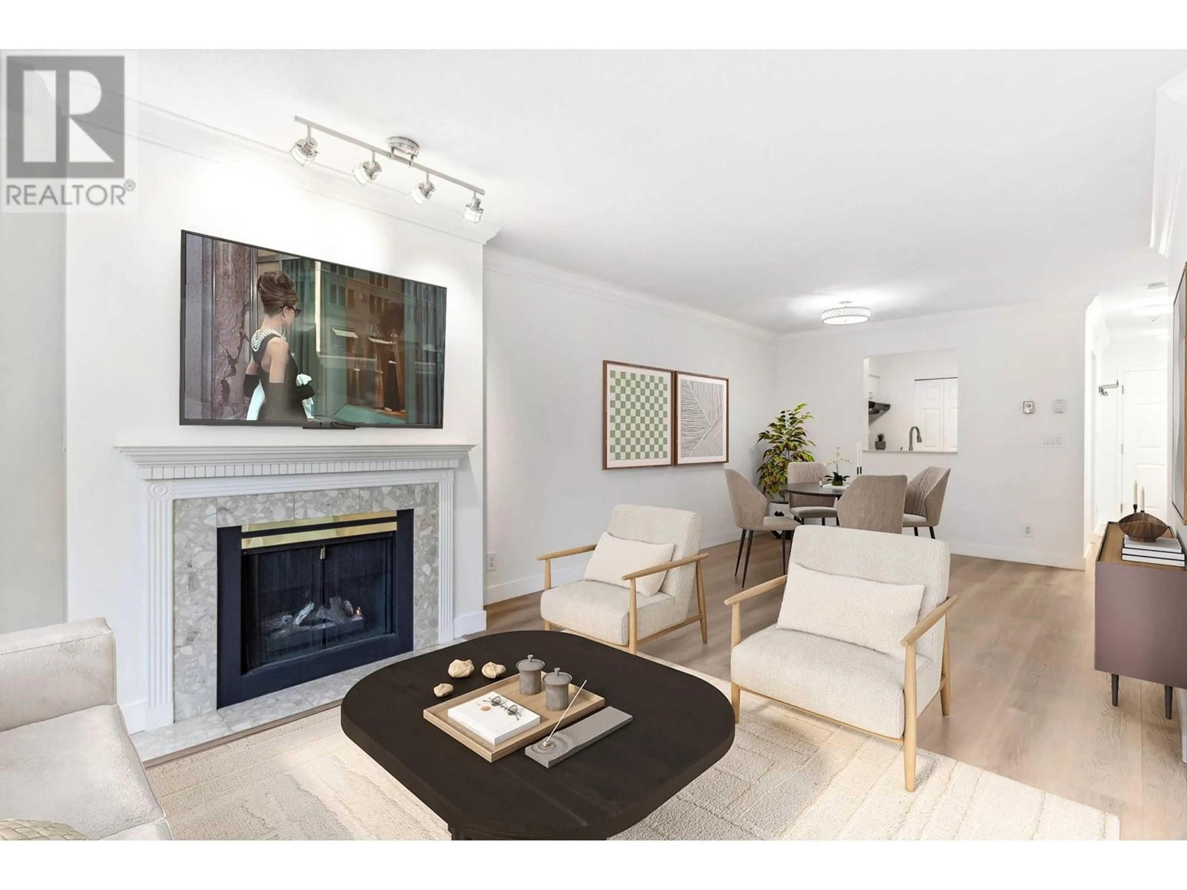 Living room with furniture, wood/laminate floor for 212 - 6820 RUMBLE STREET, Burnaby British Columbia V5E4H9
