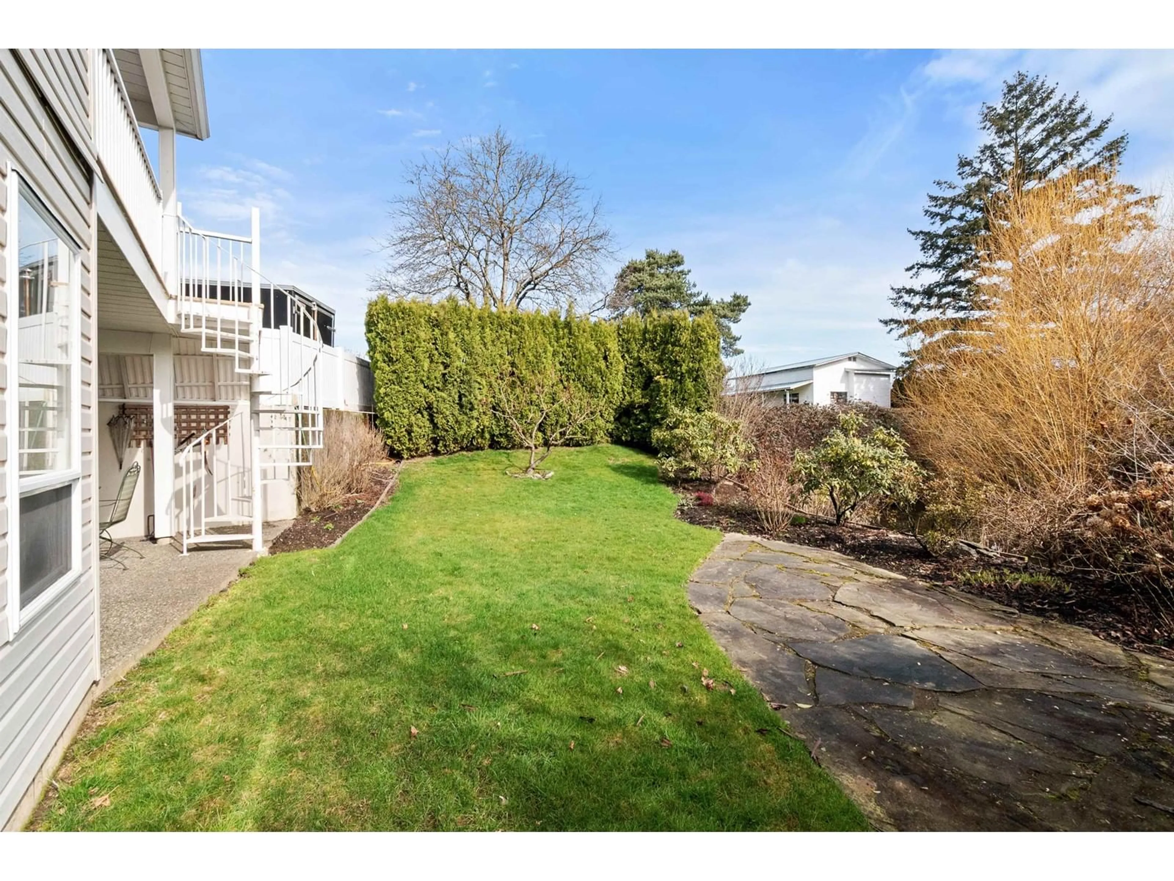 A pic from outside/outdoor area/front of a property/back of a property/a pic from drone, unknown for 11 - 8500 YOUNG ROAD, Chilliwack British Columbia V2P4P1