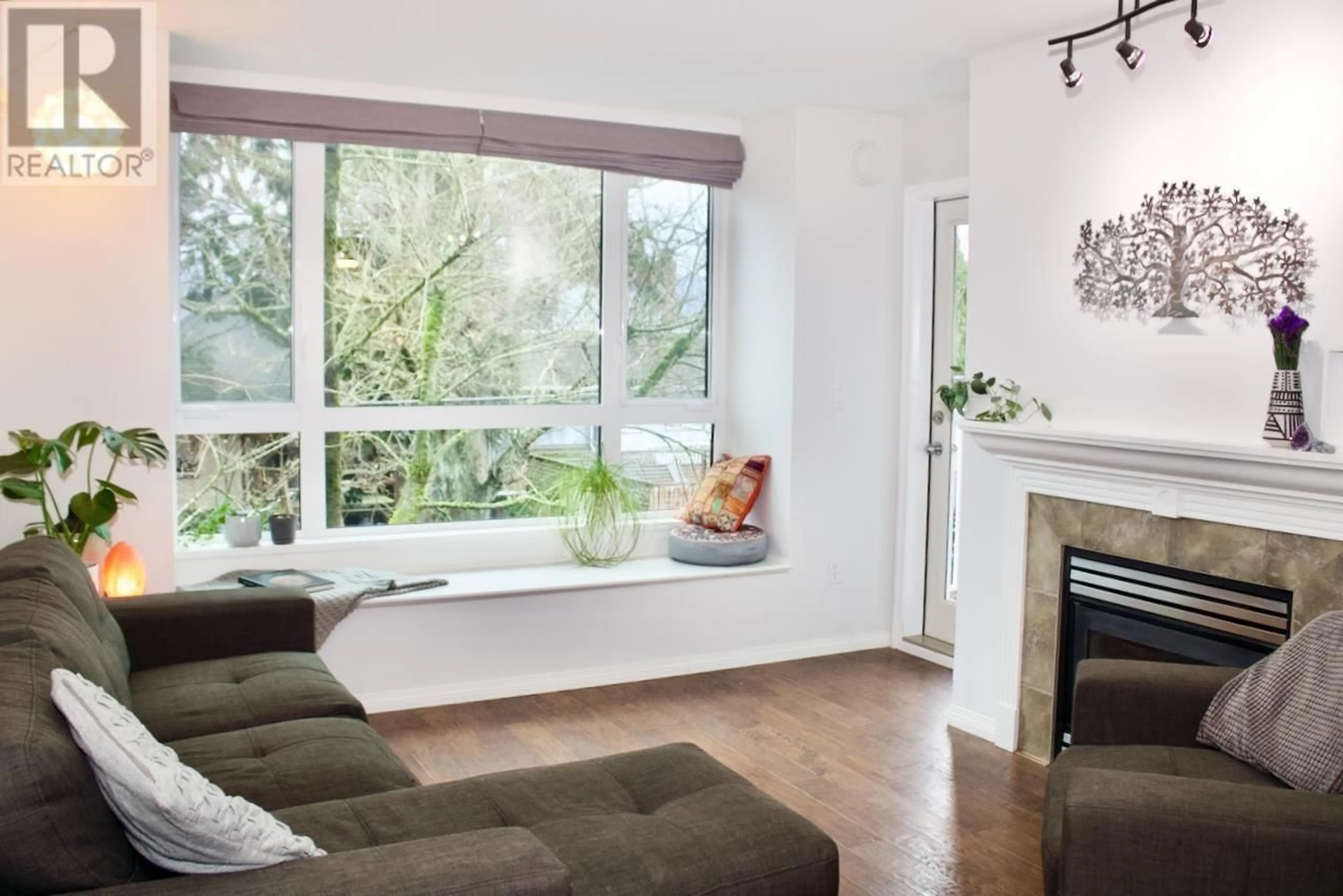 Living room with furniture, wood/laminate floor for 310 - 3235 4TH AVENUE, Vancouver British Columbia V6K1R8
