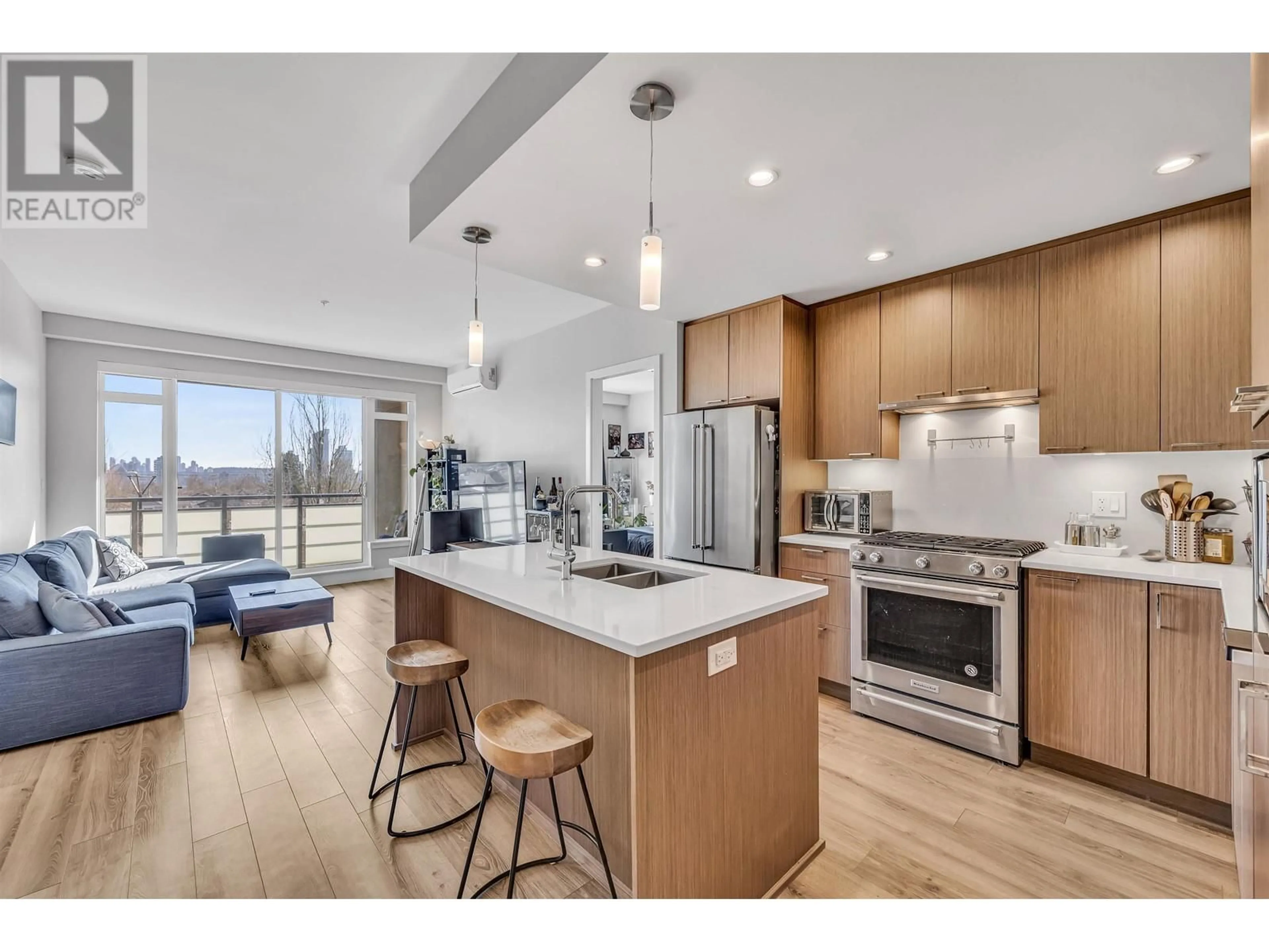 Open concept kitchen, wood/laminate floor for 406 - 4289 HASTINGS STREET, Burnaby British Columbia V5C2J5
