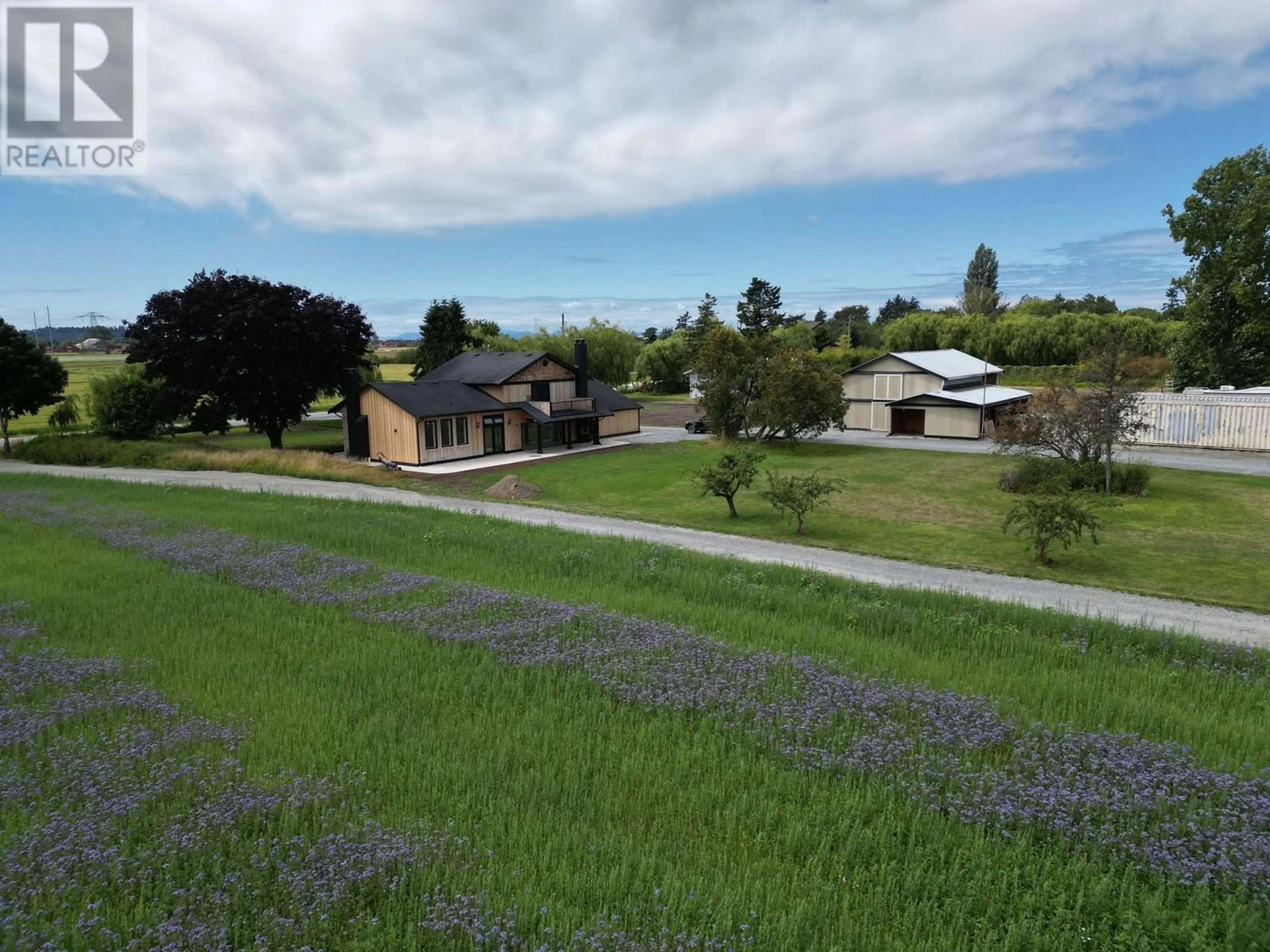 A pic from outside/outdoor area/front of a property/back of a property/a pic from drone, mountain view for 5465 34B AVENUE, Ladner British Columbia V4L2P1