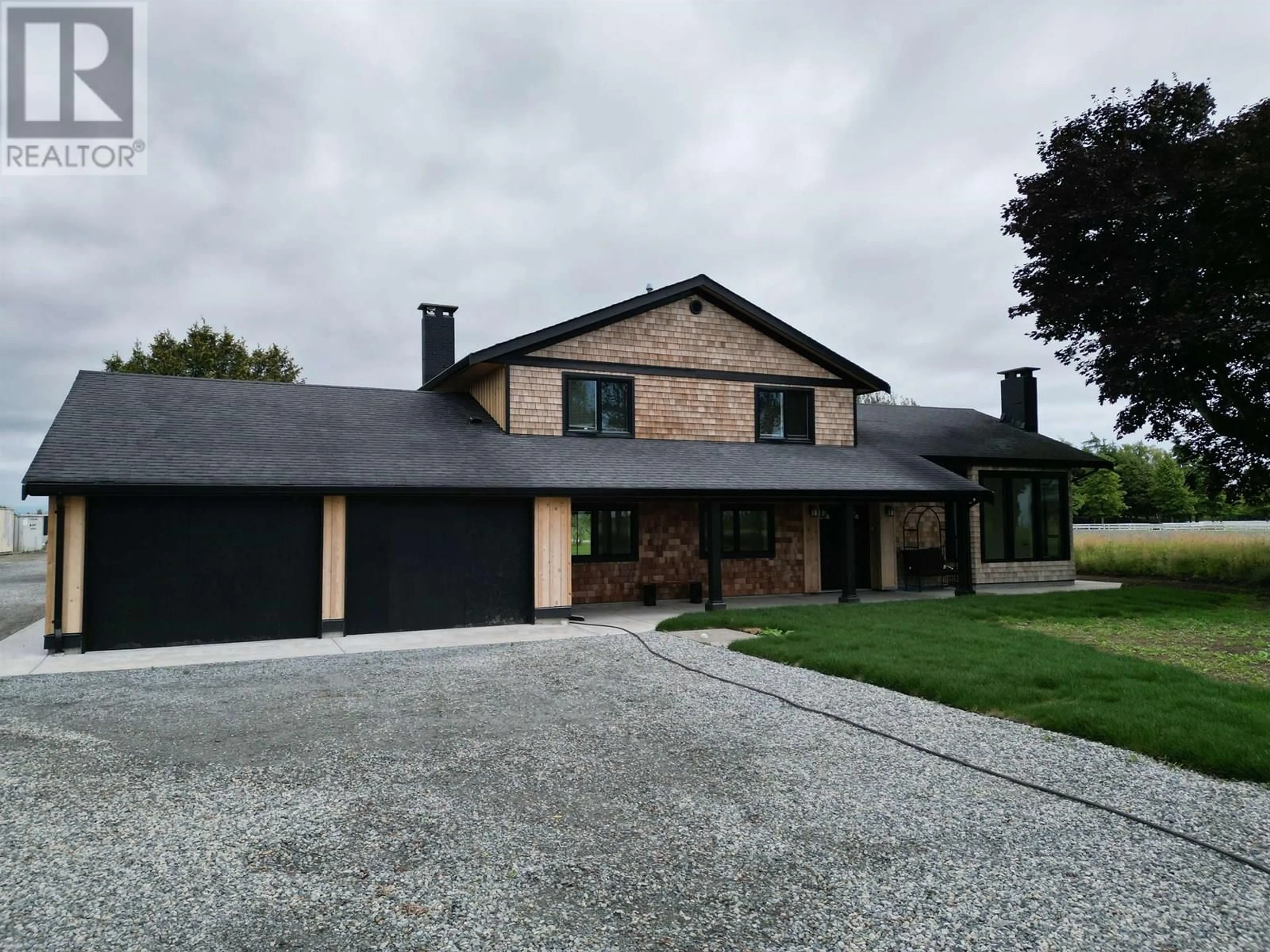 A pic from outside/outdoor area/front of a property/back of a property/a pic from drone, street for 5465 34B AVENUE, Ladner British Columbia V4L2P1