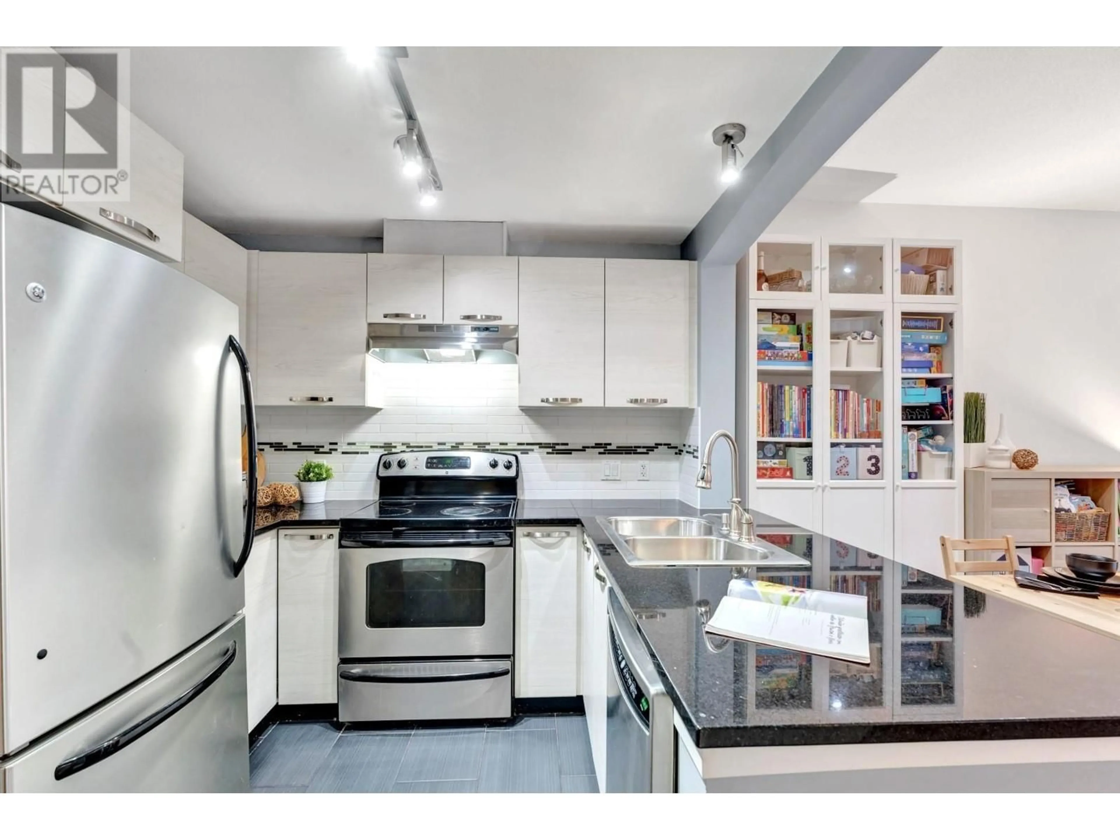 Open concept kitchen, ceramic/tile floor for 308 - 7478 BYRNEPARK WALK, Burnaby British Columbia V3N0B5