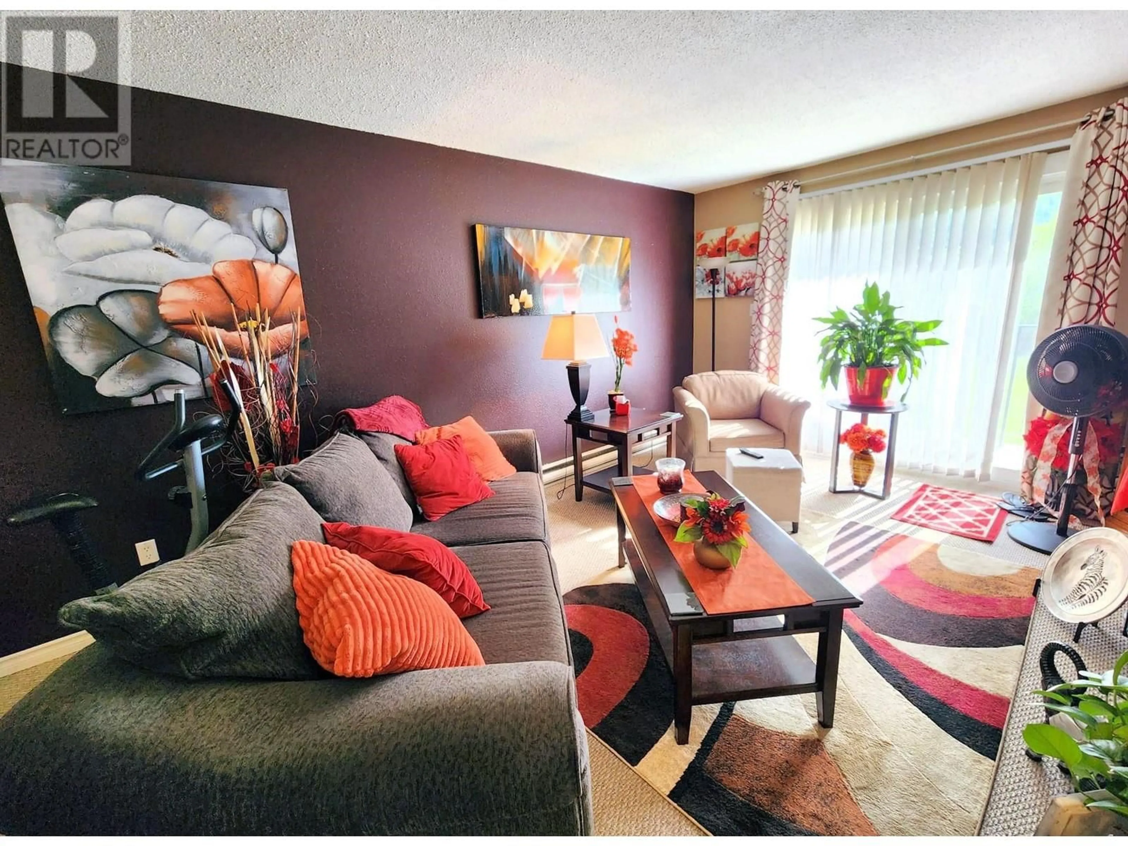 Living room with furniture, wood/laminate floor for 209 - 2644 ARNETT AVENUE, Prince George British Columbia V2N4J5