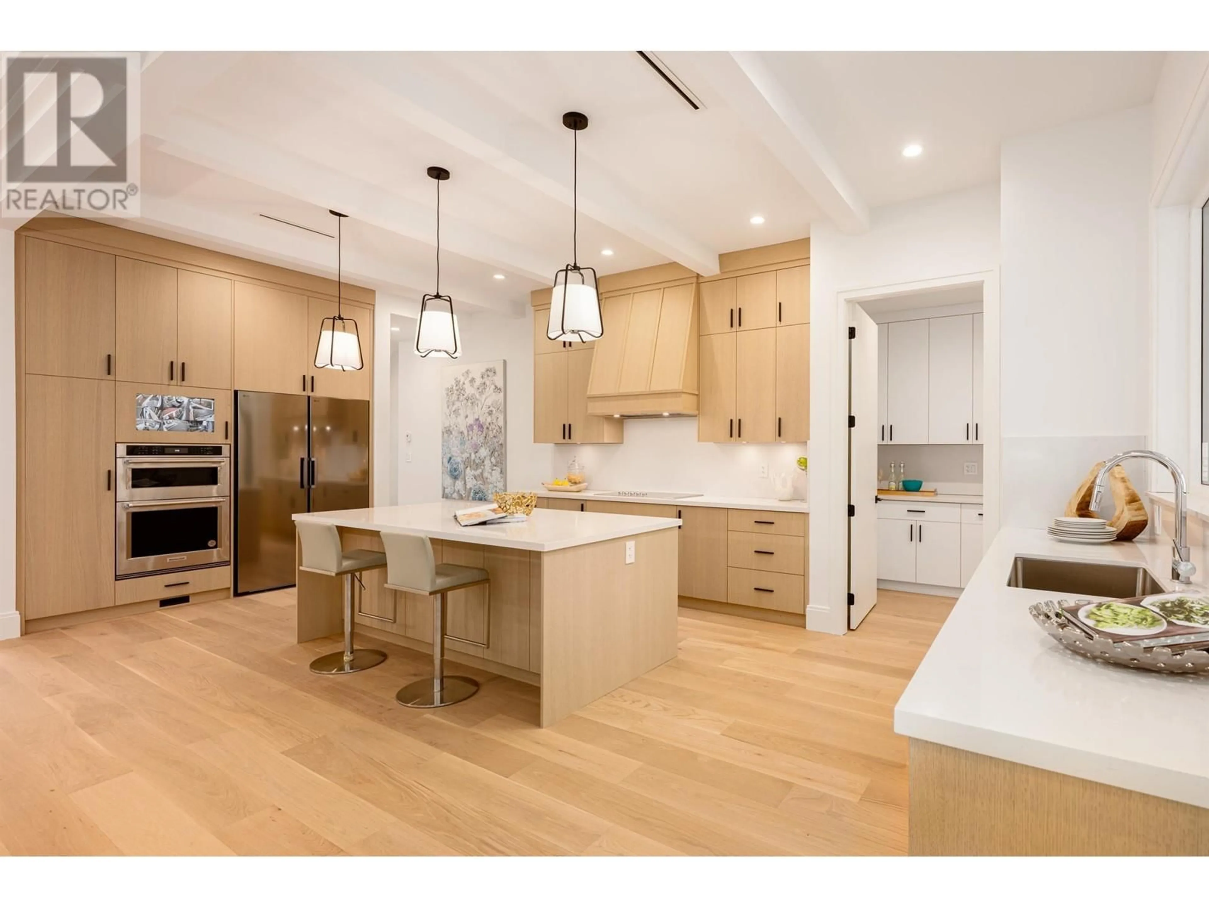 Open concept kitchen, wood/laminate floor for 1493 55 STREET, Delta British Columbia V4M3K4