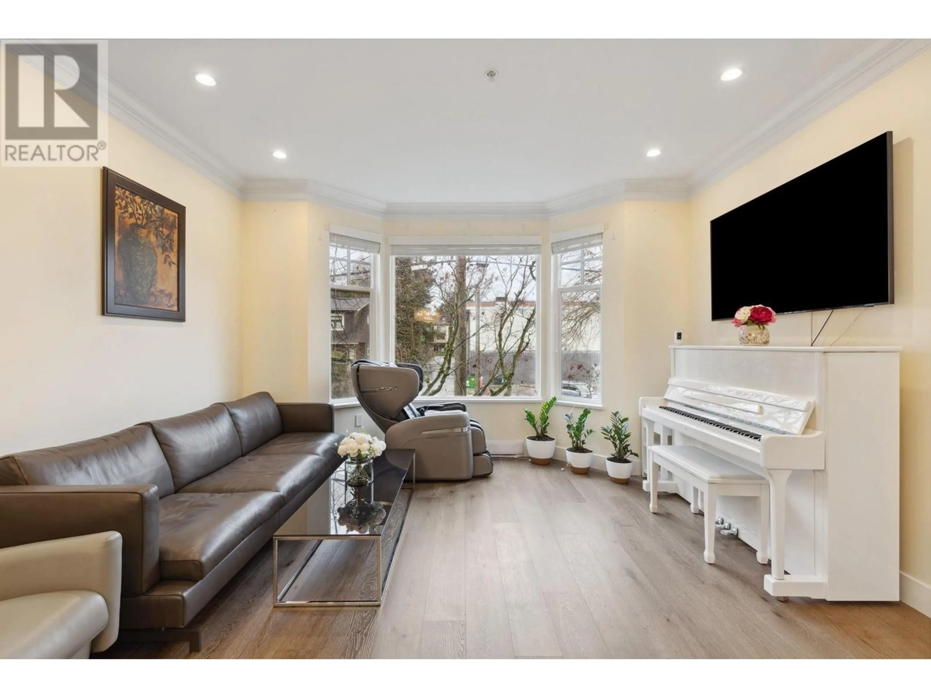 Living room with furniture, wood/laminate floor for 2160 W 8TH AVENUE, Vancouver British Columbia V6K2A4