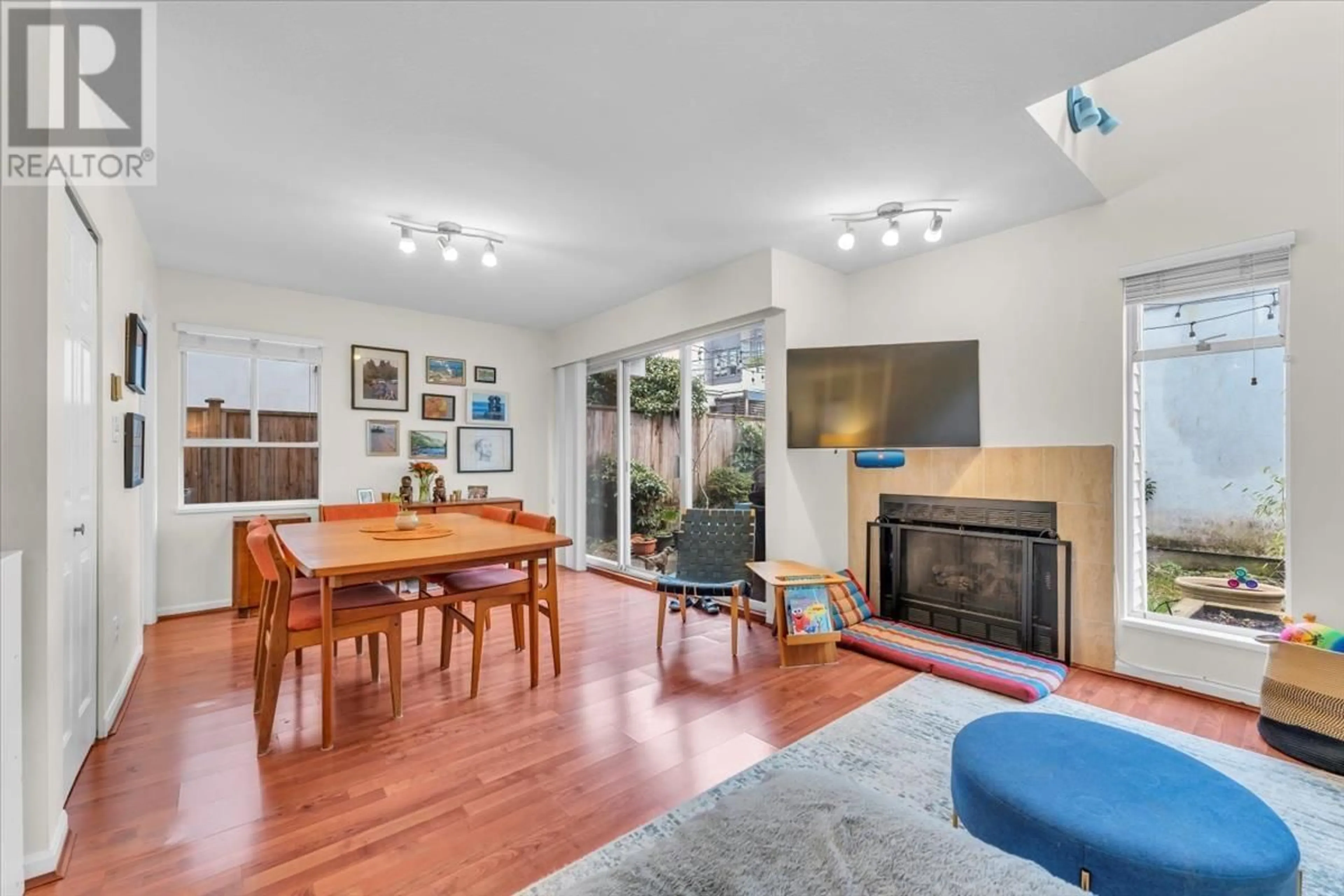 Living room with furniture, wood/laminate floor for 3060 W 8TH AVENUE, Vancouver British Columbia V6K2C1