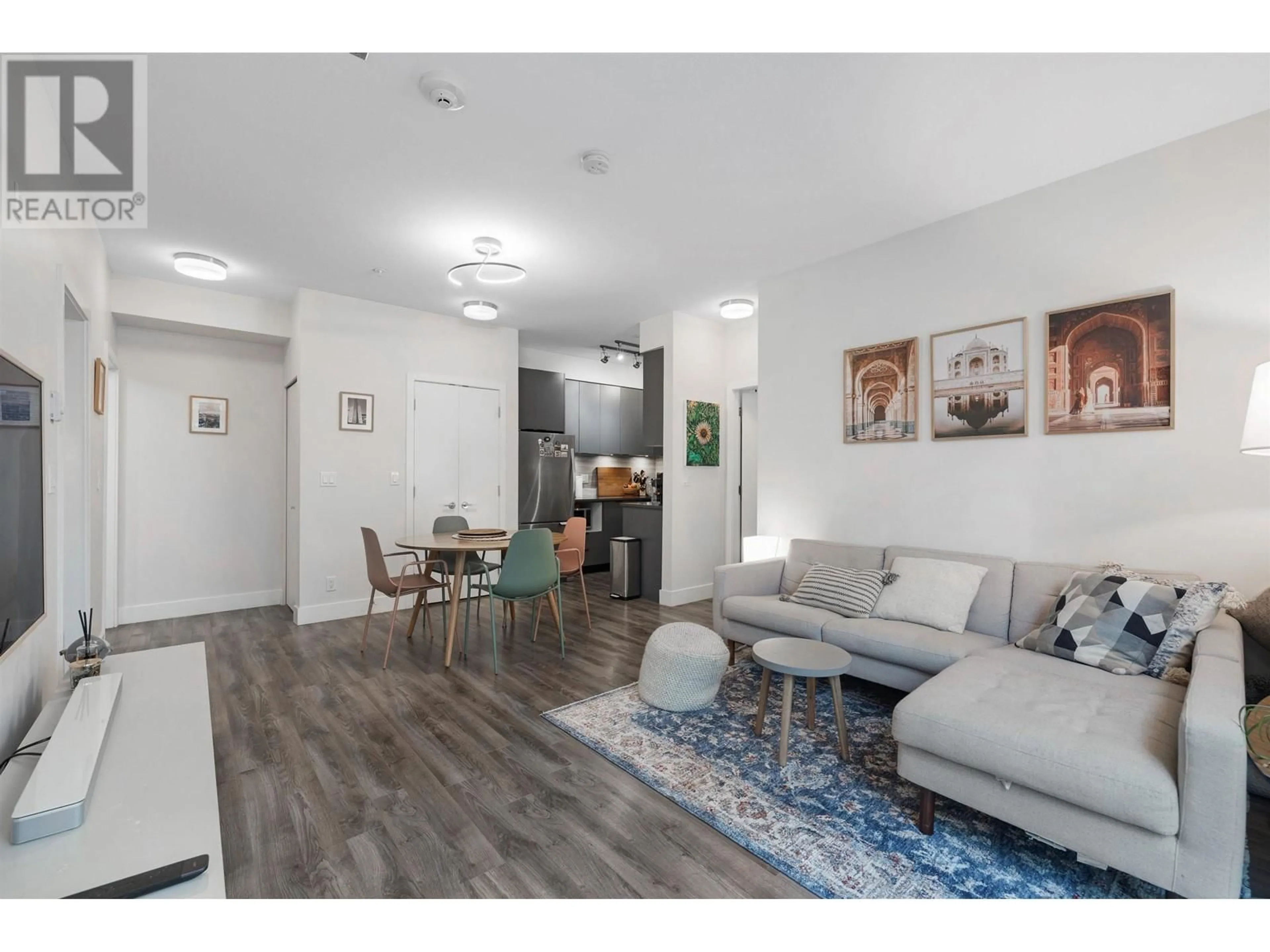 Living room with furniture, wood/laminate floor for 102 - 5355 LANE STREET, Burnaby British Columbia V5H0H1