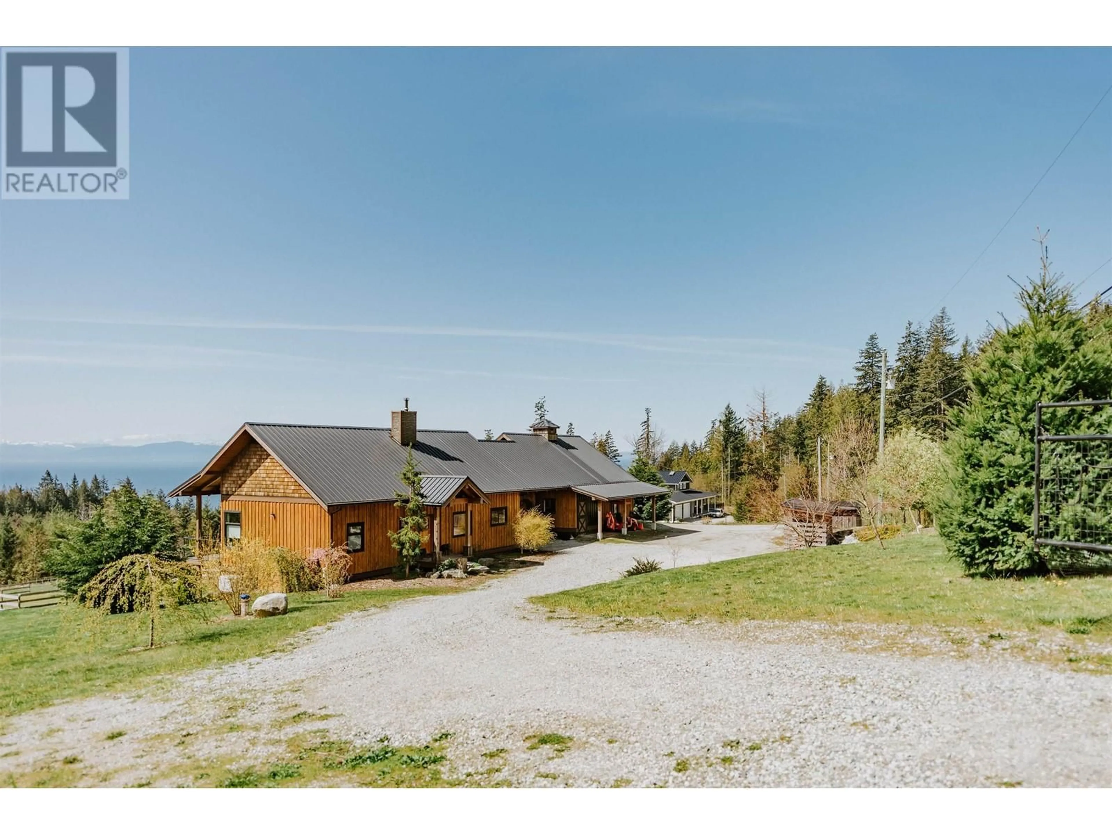 A pic from outside/outdoor area/front of a property/back of a property/a pic from drone, mountain view for 2247 PIXTON ROAD, Roberts Creek British Columbia V0N2W5