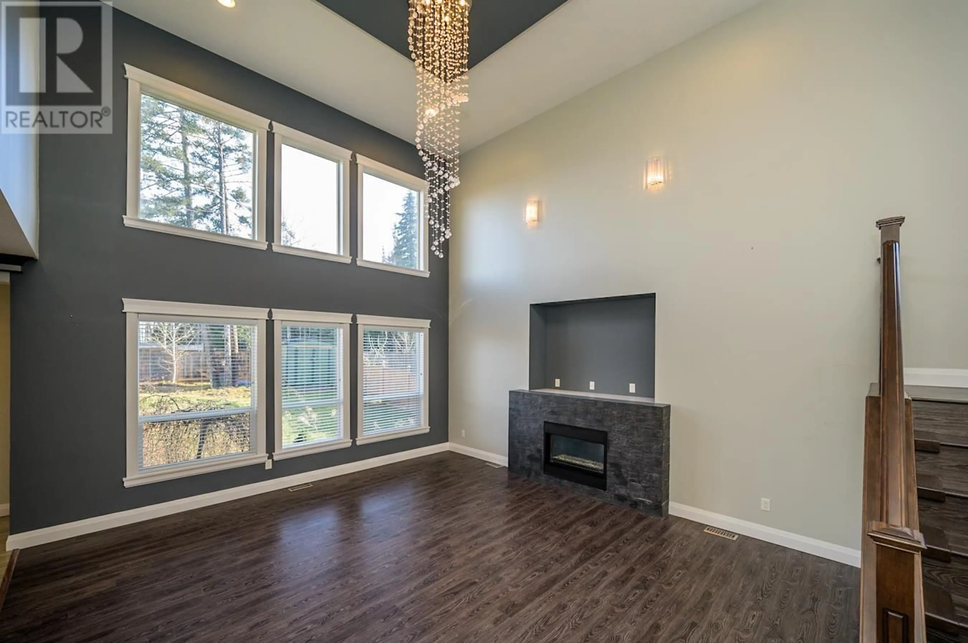 Living room with furniture, wood/laminate floor for 2662 MAURICE DRIVE, Prince George British Columbia V2N0B9