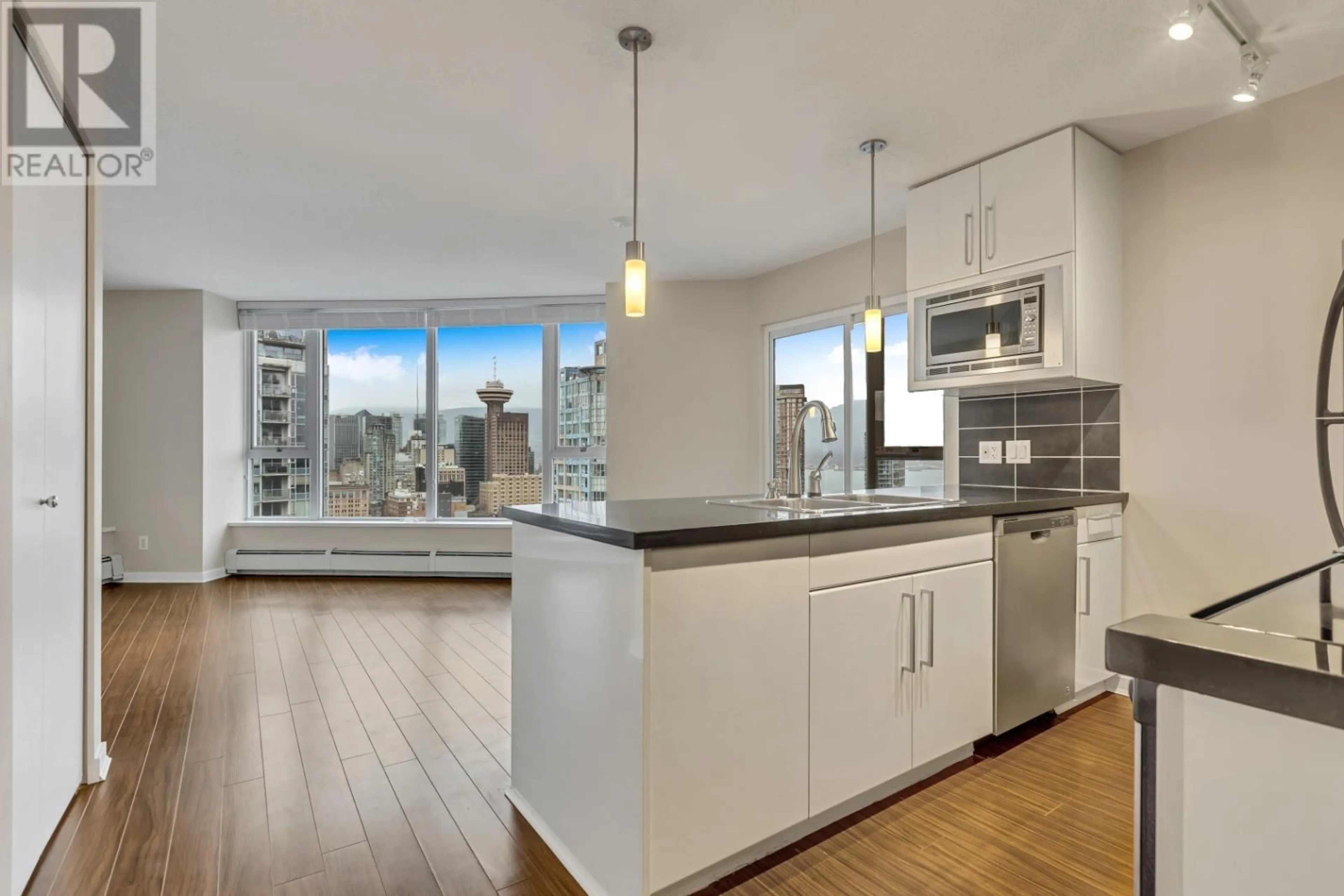 Open concept kitchen, wood/laminate floor for 3201 689 ABBOTT STREET, Vancouver British Columbia V6B0J2