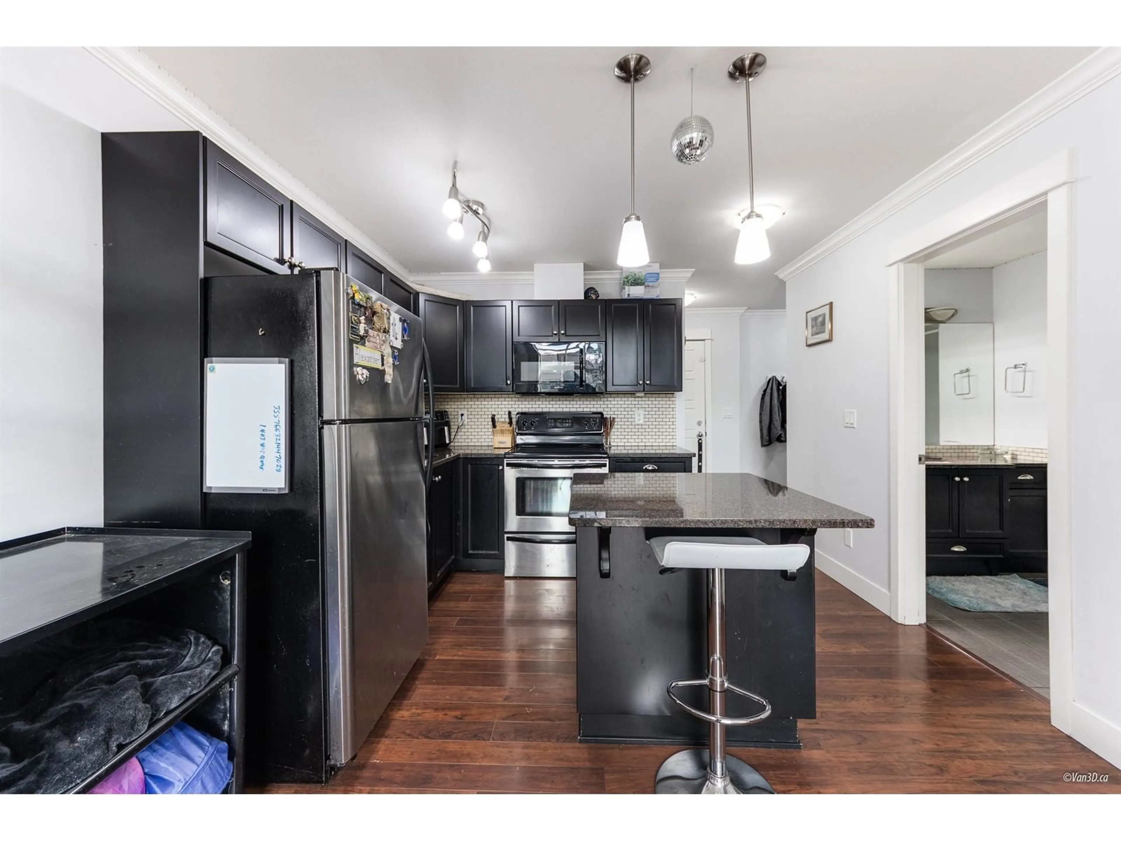 Open concept kitchen, wood/laminate floor for 402 - 30525 CARDINAL, Abbotsford British Columbia V2T0A8