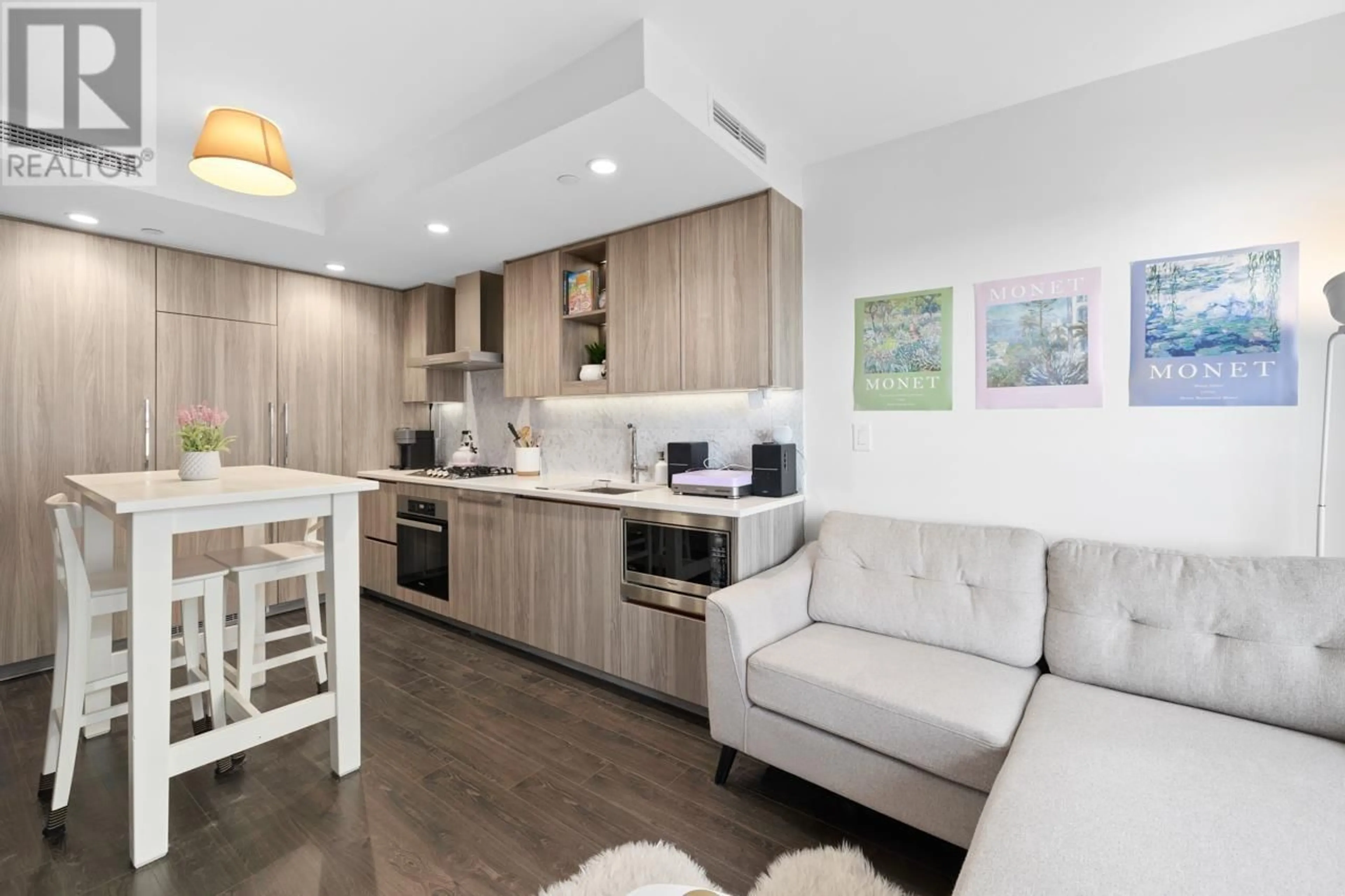 Open concept kitchen, wood/laminate floor for 402 - 1768 COOK STREET, Vancouver British Columbia V5Y0N3